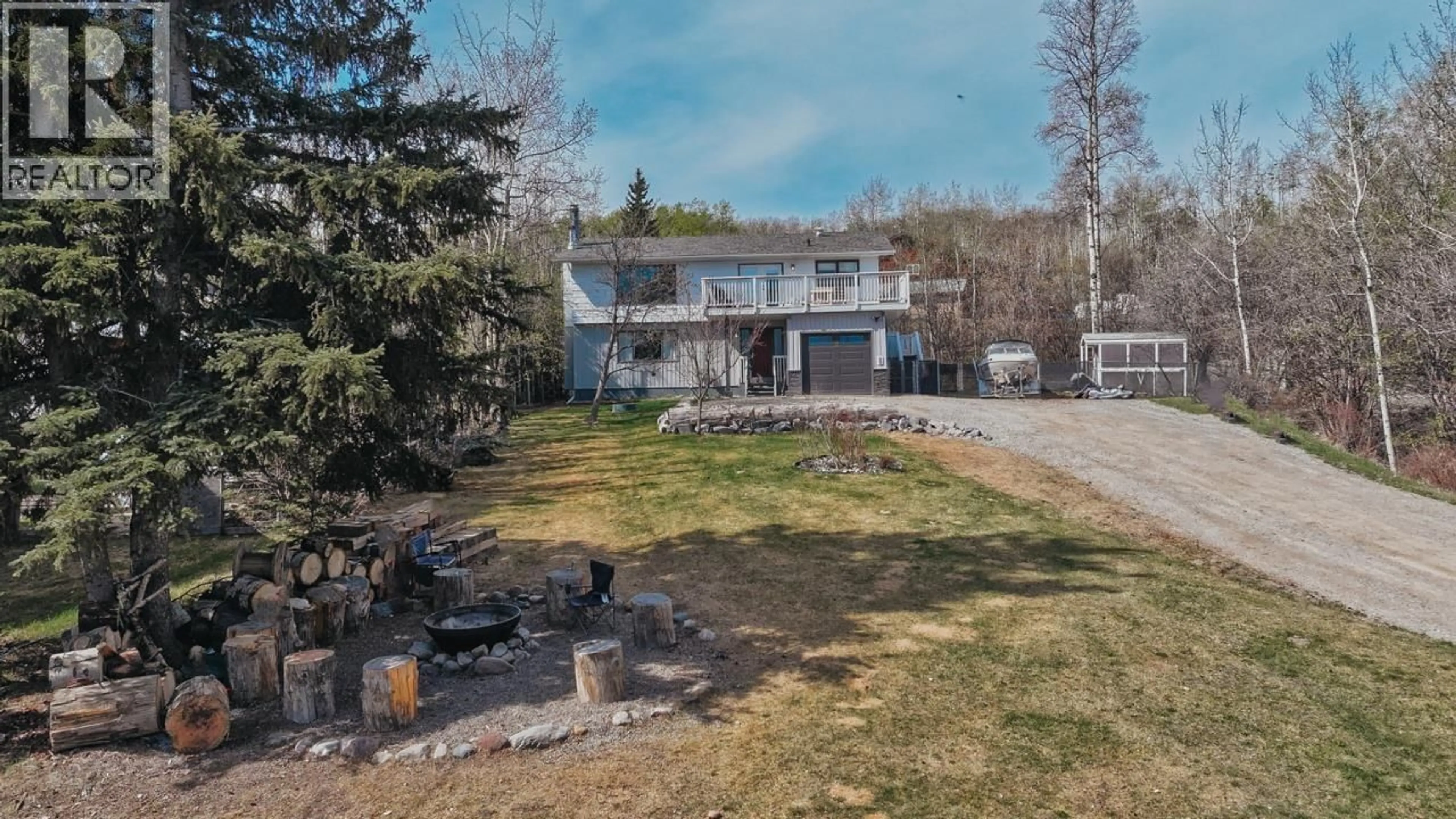 A pic from outside/outdoor area/front of a property/back of a property/a pic from drone, unknown for 13223 LAKESHORE DRIVE, Fort St. John British Columbia V0C1H0