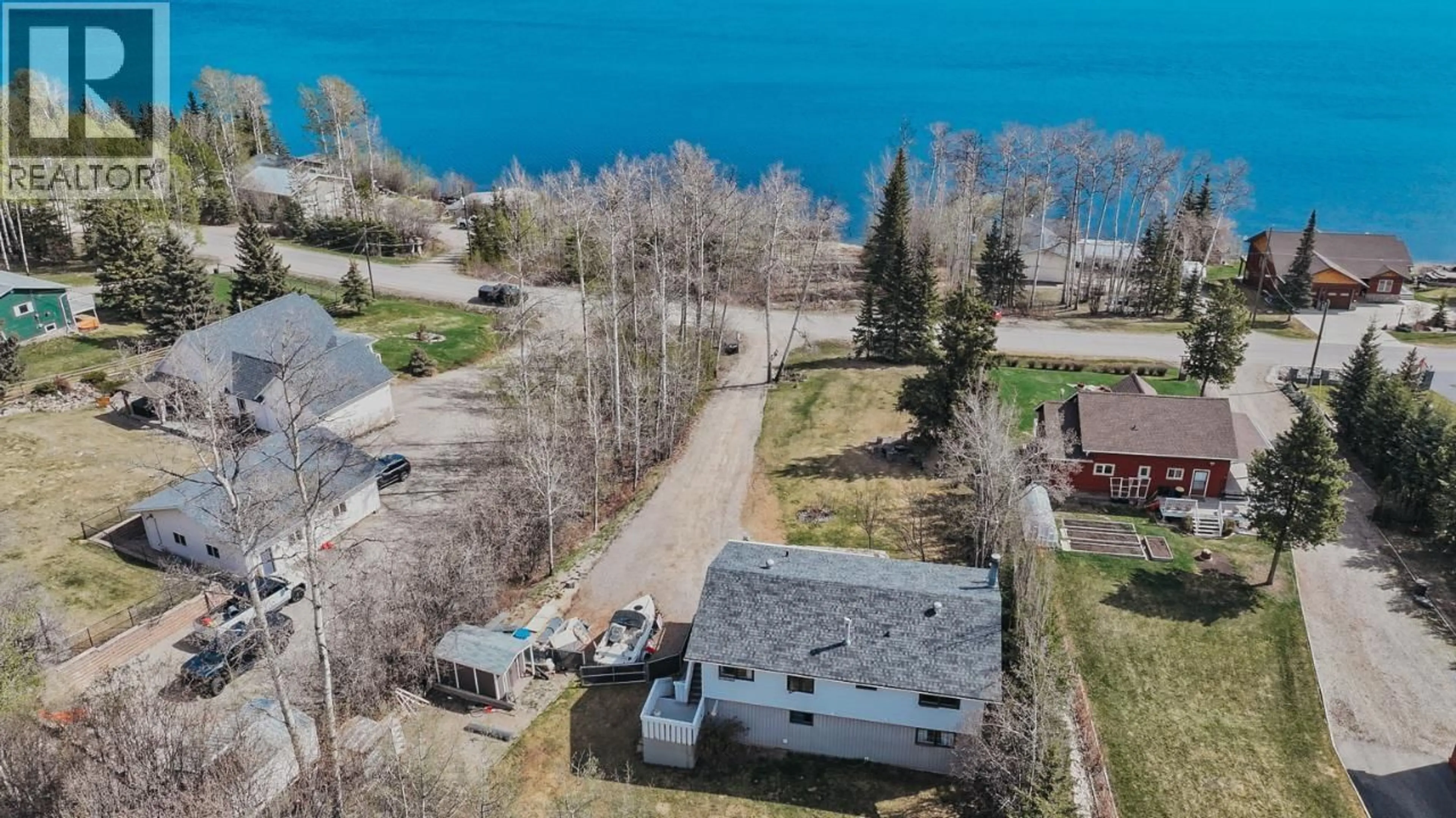 A pic from outside/outdoor area/front of a property/back of a property/a pic from drone, water/lake/river/ocean view for 13223 LAKESHORE DRIVE, Fort St. John British Columbia V0C1H0