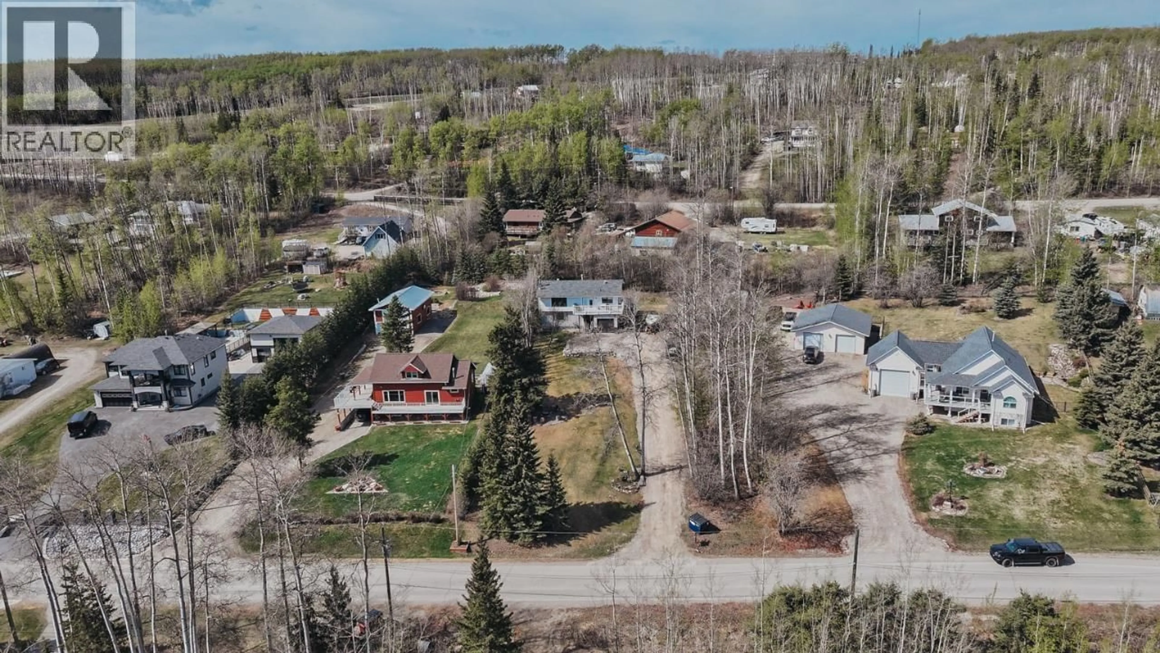 A pic from outside/outdoor area/front of a property/back of a property/a pic from drone, unknown for 13223 LAKESHORE DRIVE, Fort St. John British Columbia V0C1H0
