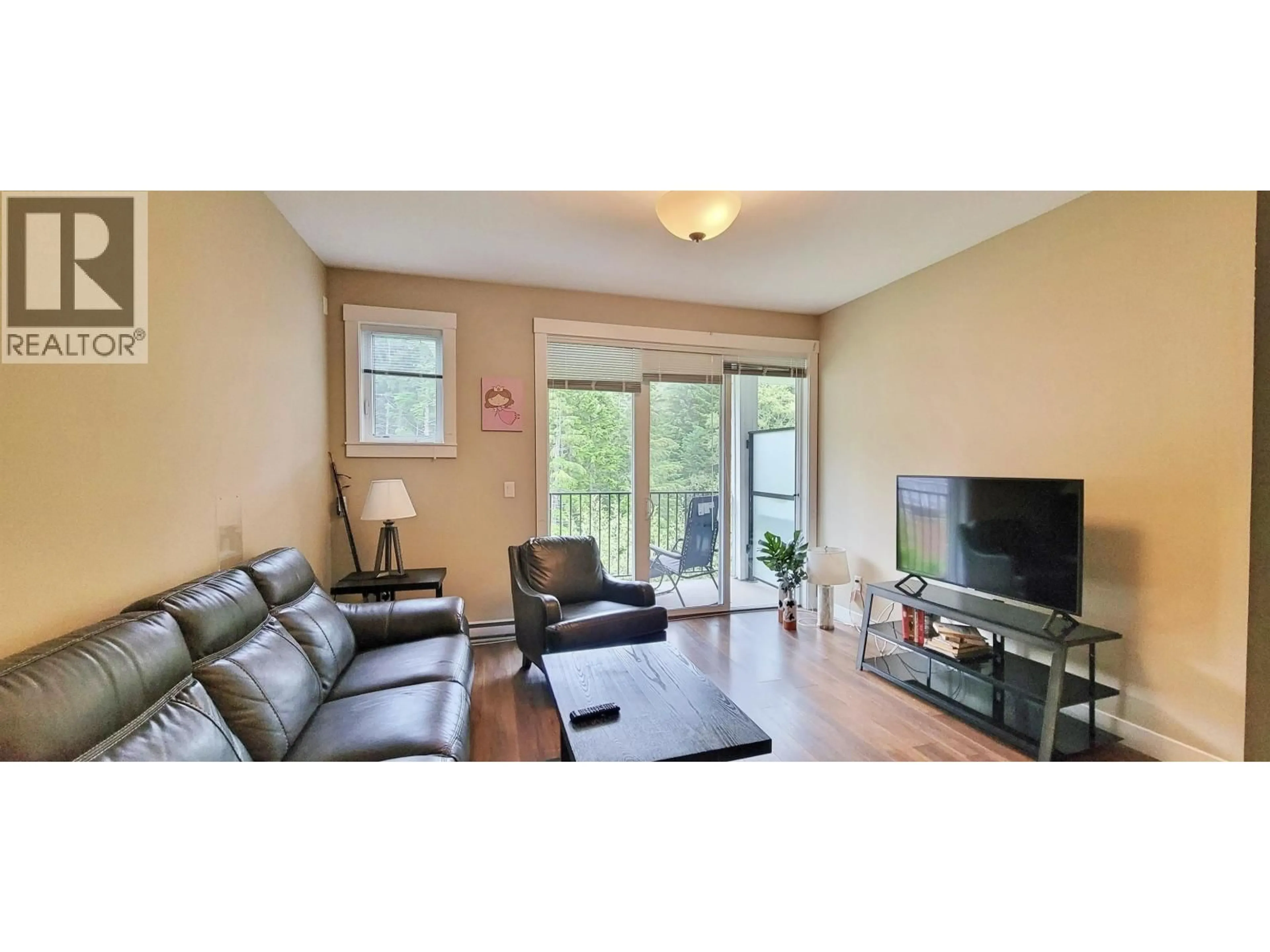 Living room with furniture, wood/laminate floor for 205 - 110 BAXTER AVENUE, Kitimat British Columbia V8C2N9