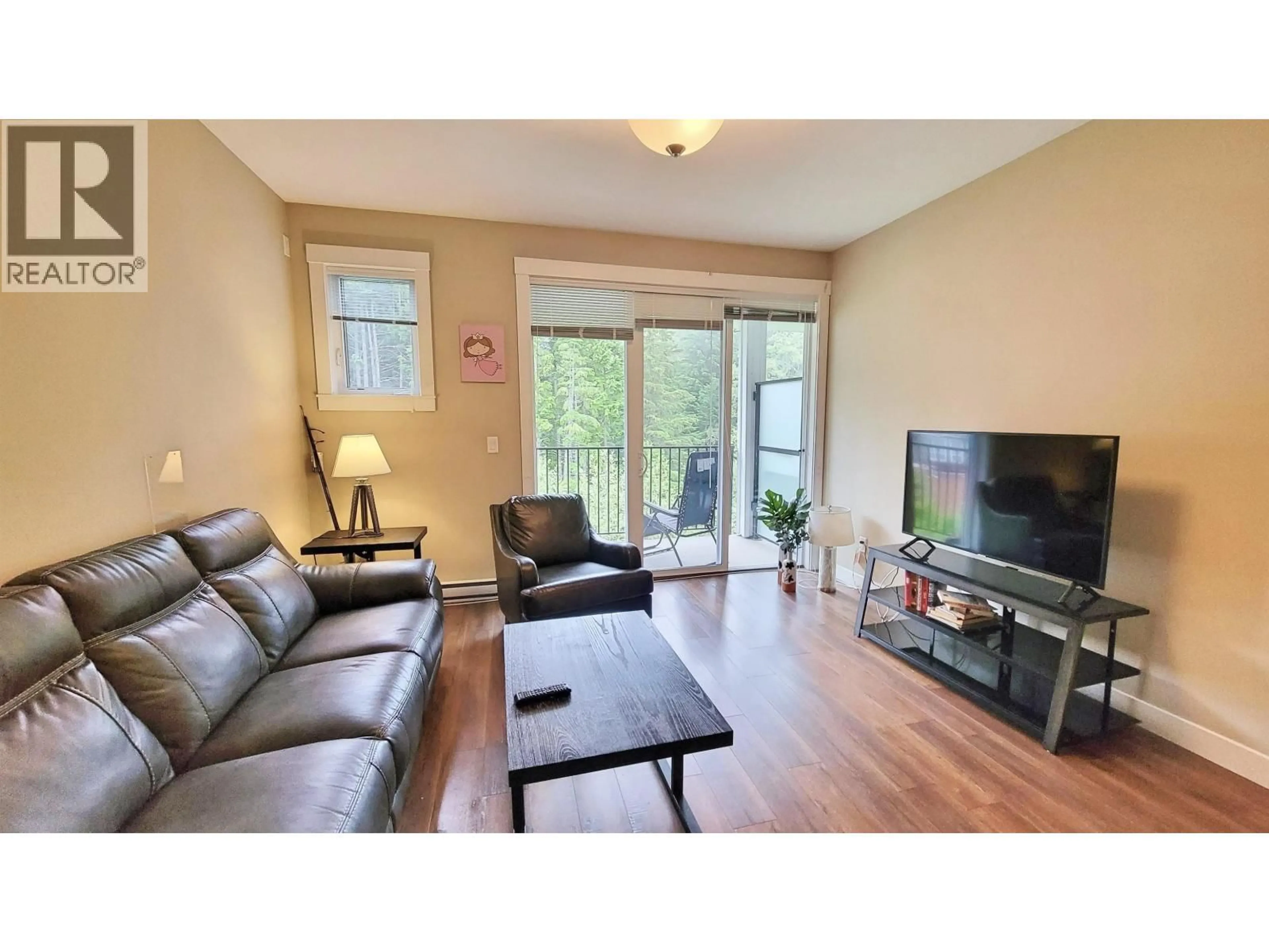 Living room with furniture, wood/laminate floor for 205 - 110 BAXTER AVENUE, Kitimat British Columbia V8C2N9