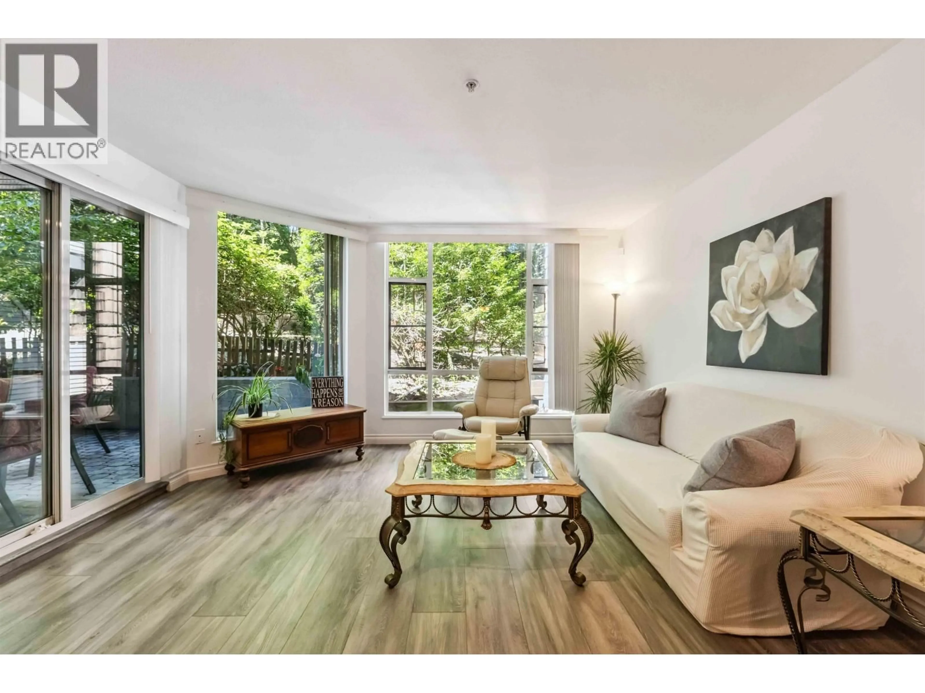 Living room with furniture, wood/laminate floor for 206 - 22233 RIVER ROAD, Maple Ridge British Columbia V2X3N7