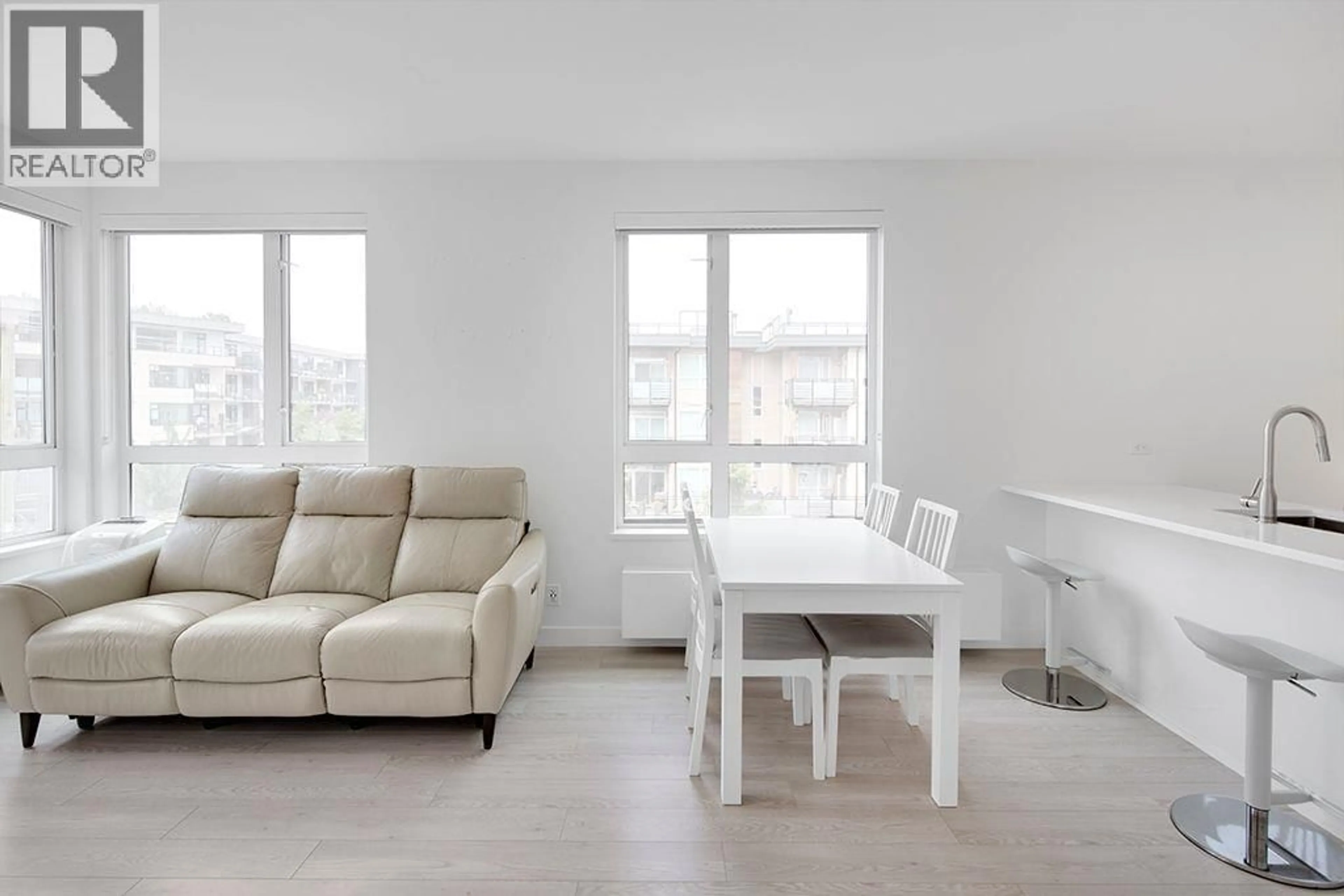 Living room with furniture, wood/laminate floor for 308 - 711 14TH STREET, North Vancouver British Columbia V7M3E8