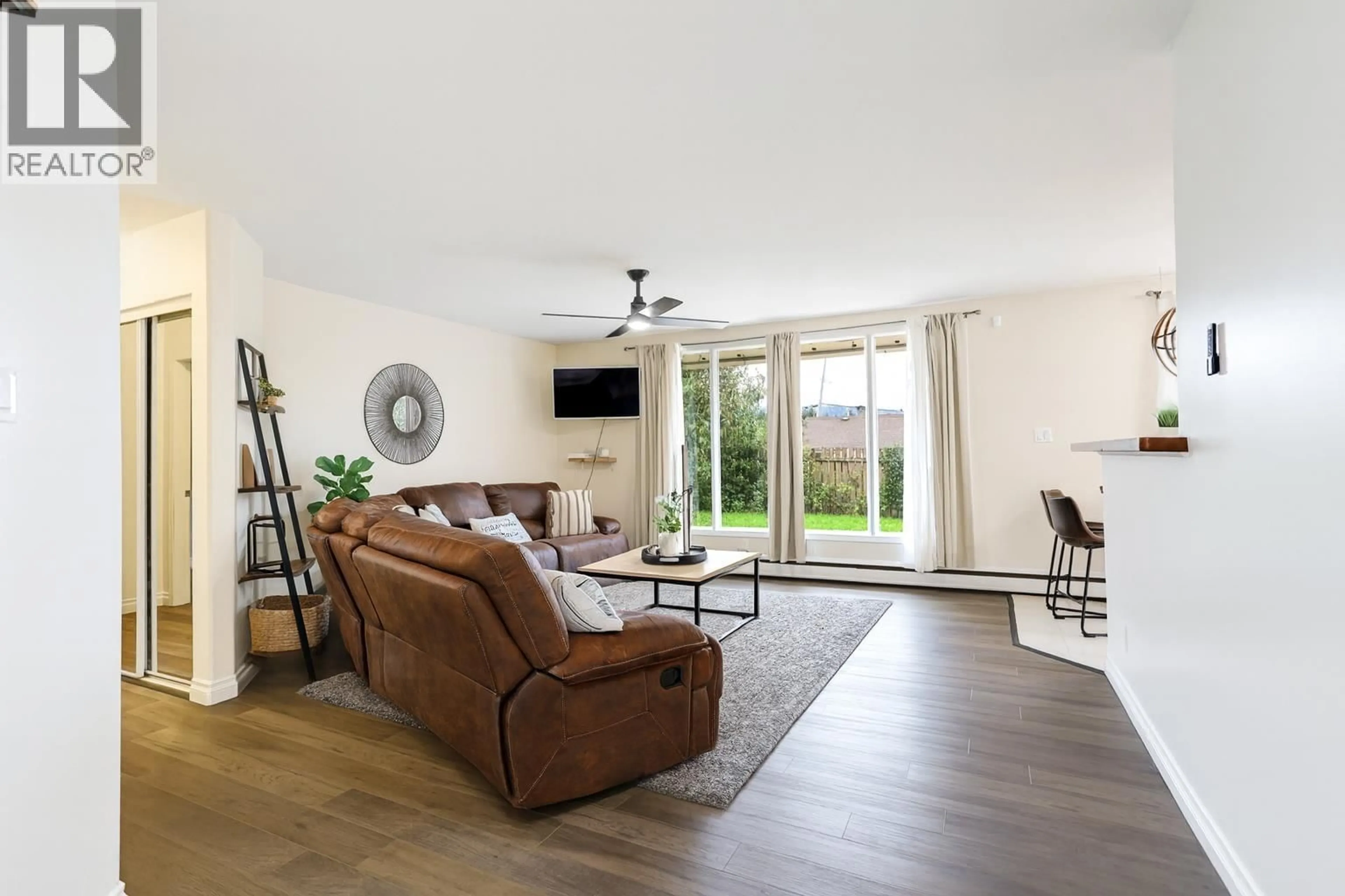 Living room with furniture, wood/laminate floor for 25 SAGUENAY STREET, Kitimat British Columbia V8C1W7