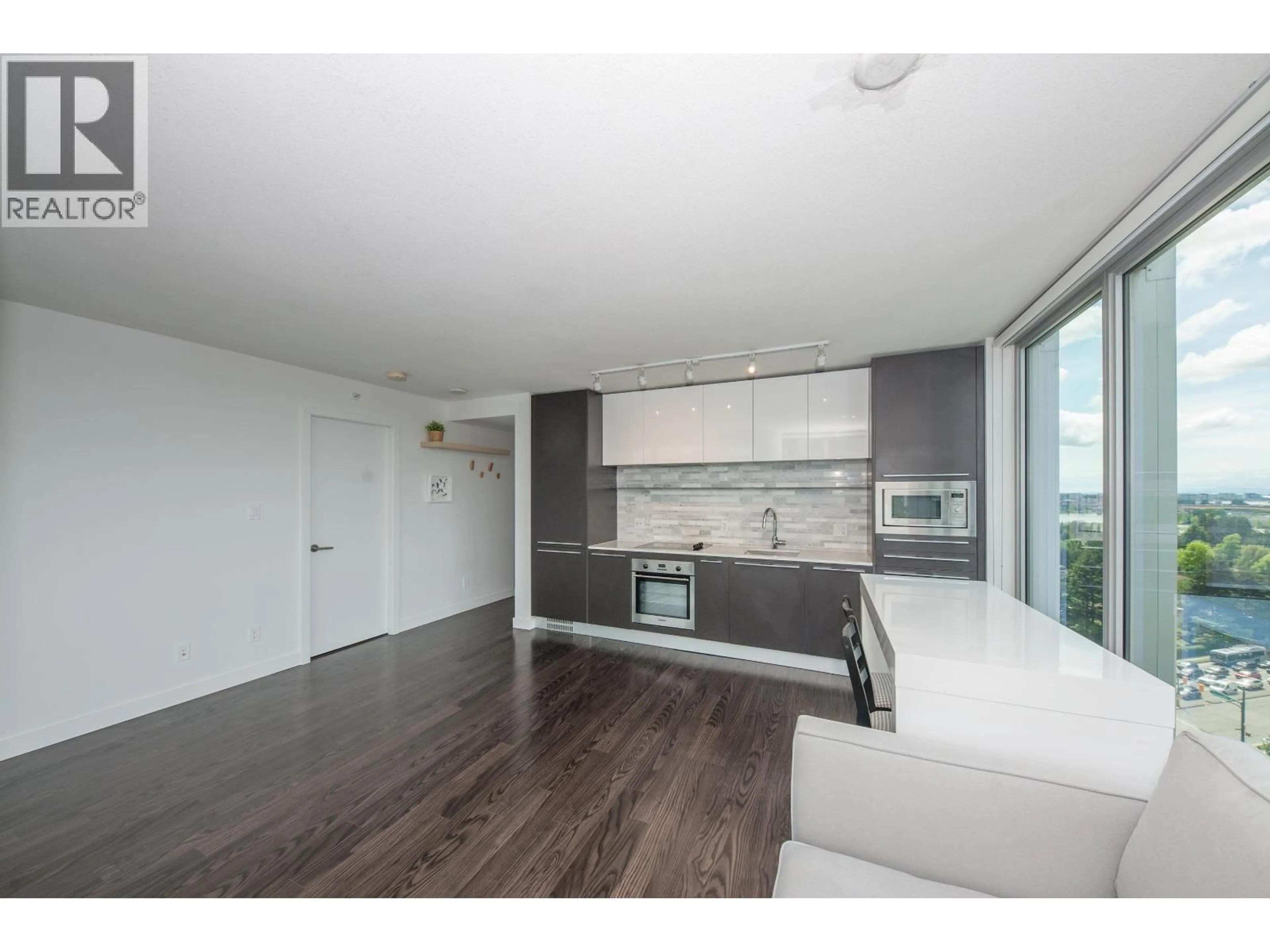 Open concept kitchen, wood/laminate floor for 1502 - 8131 NUNAVUT LANE, Vancouver British Columbia V5X0E2