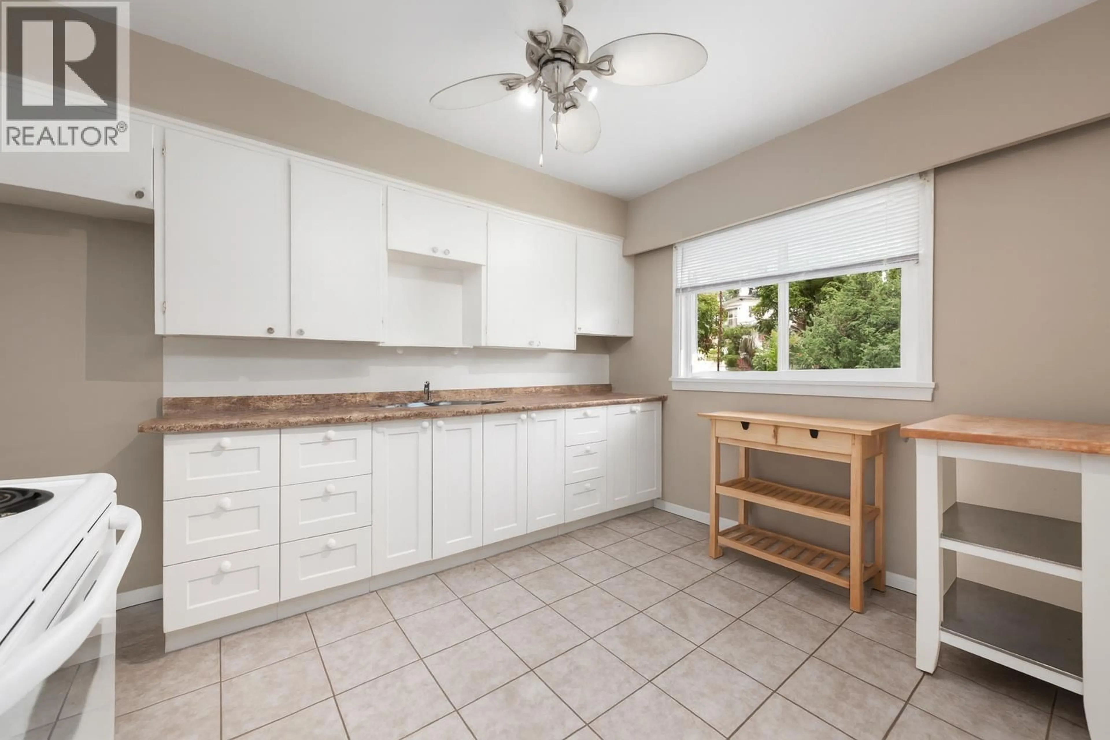 Standard kitchen, ceramic/tile floor for 4561 NANAIMO STREET, Vancouver British Columbia V5N5J5