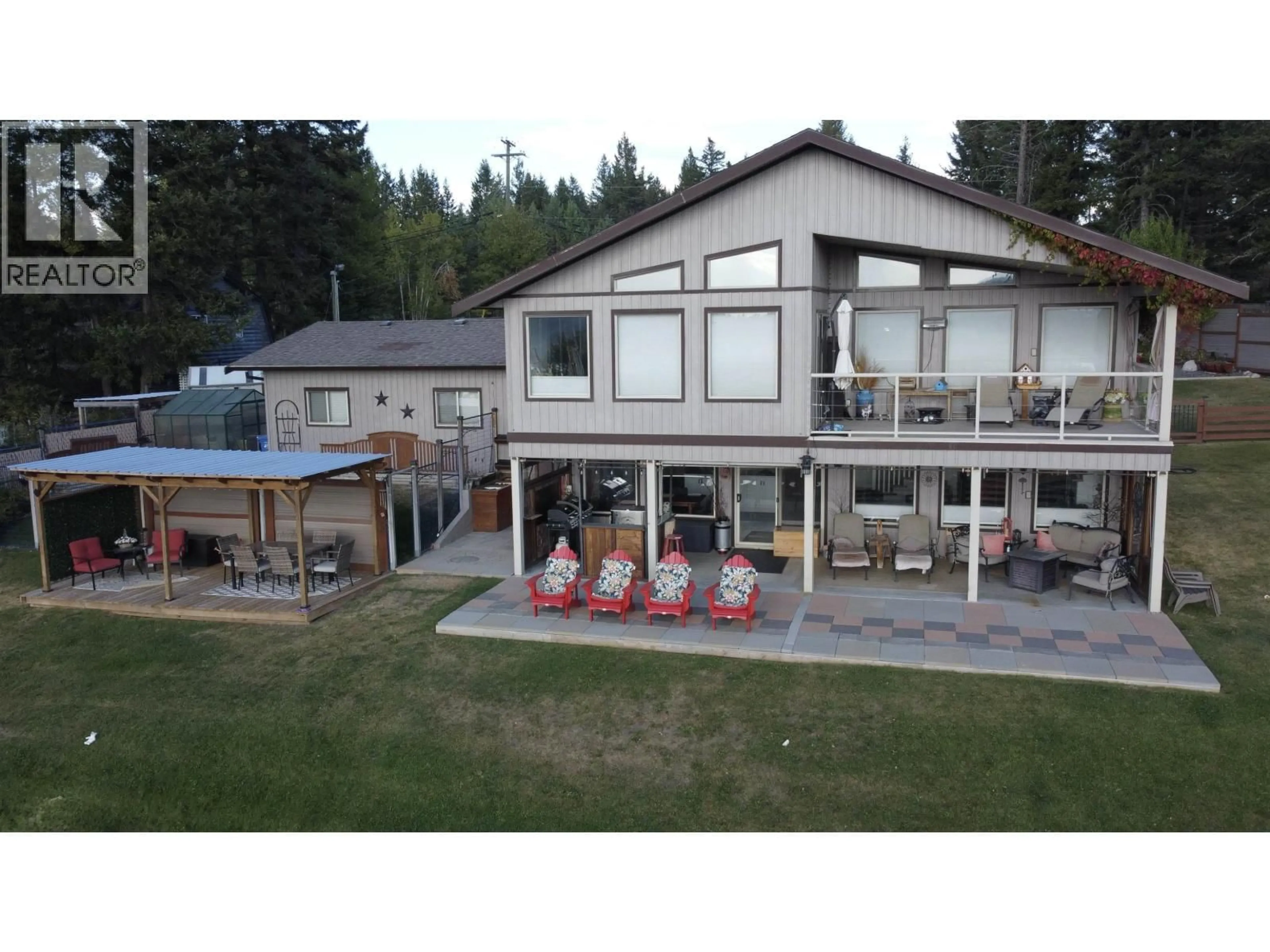 A pic from outside/outdoor area/front of a property/back of a property/a pic from drone, unknown for 4782 TELQUA DRIVE, 108 Mile Ranch British Columbia V0K2Z0