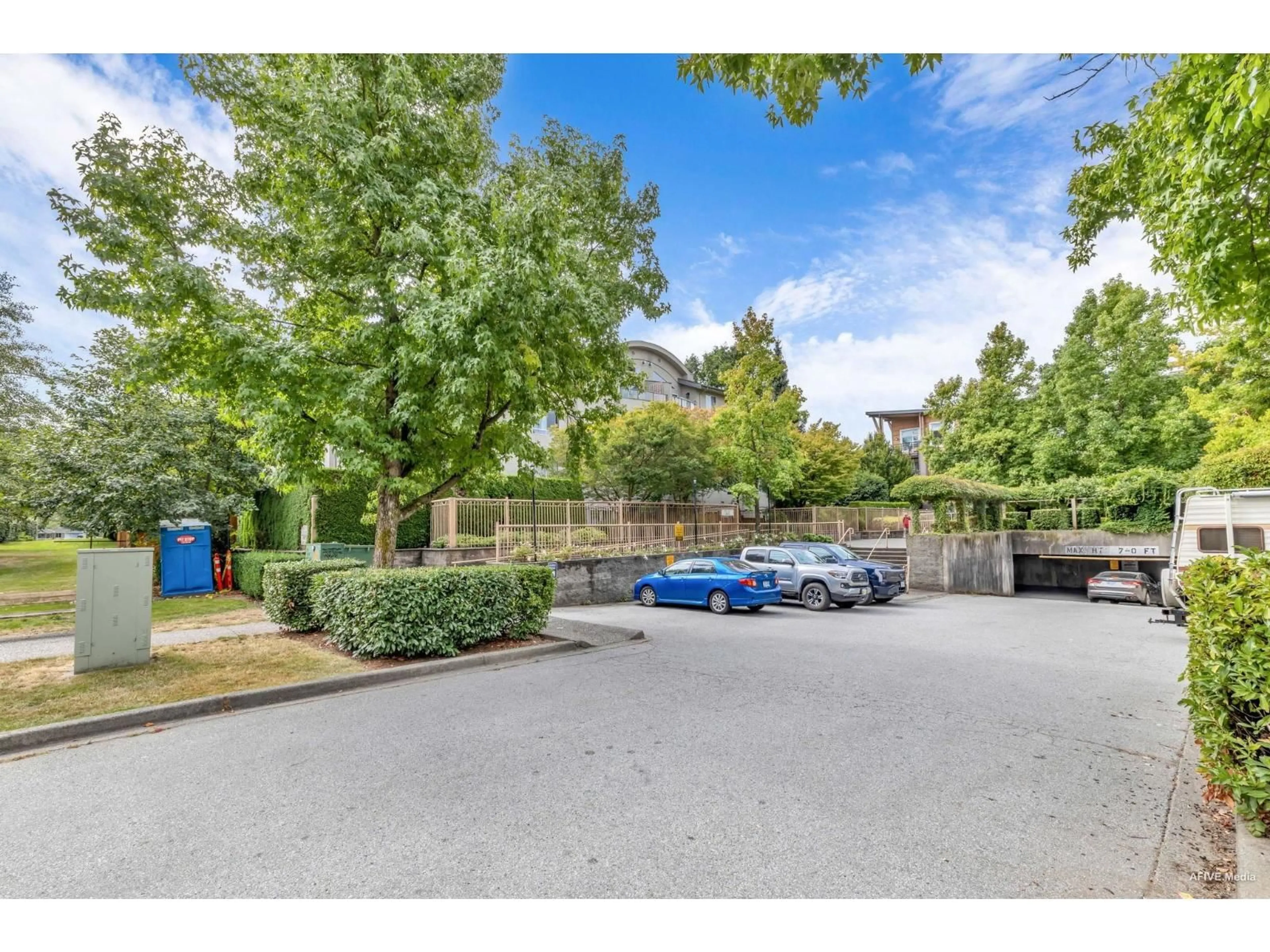 A pic from outside/outdoor area/front of a property/back of a property/a pic from drone, street for 103 - 7475 138, Surrey British Columbia V3W0Y9