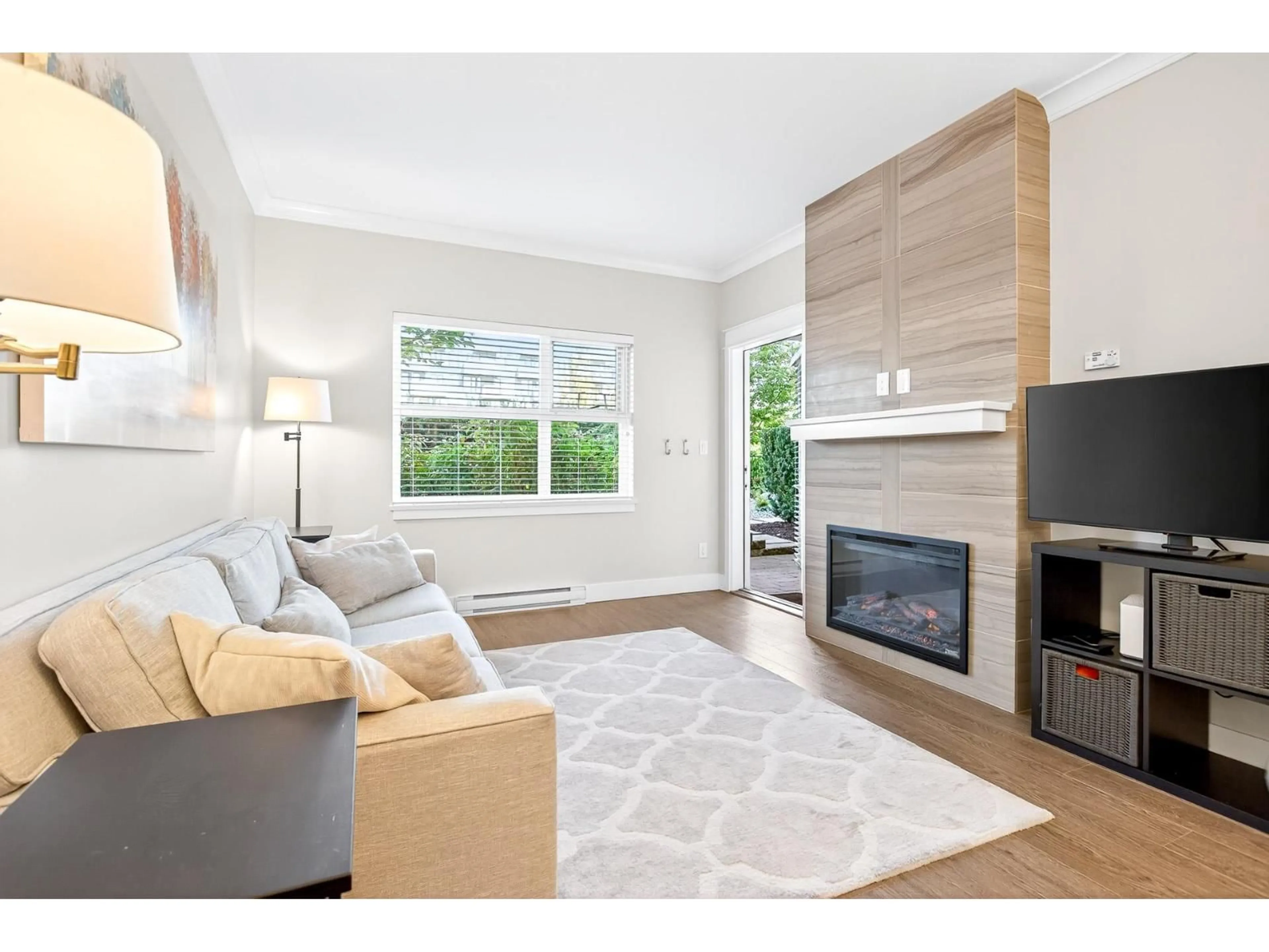 Living room with furniture, wood/laminate floor for 105 - 5020 221A, Langley British Columbia V2Y0V5