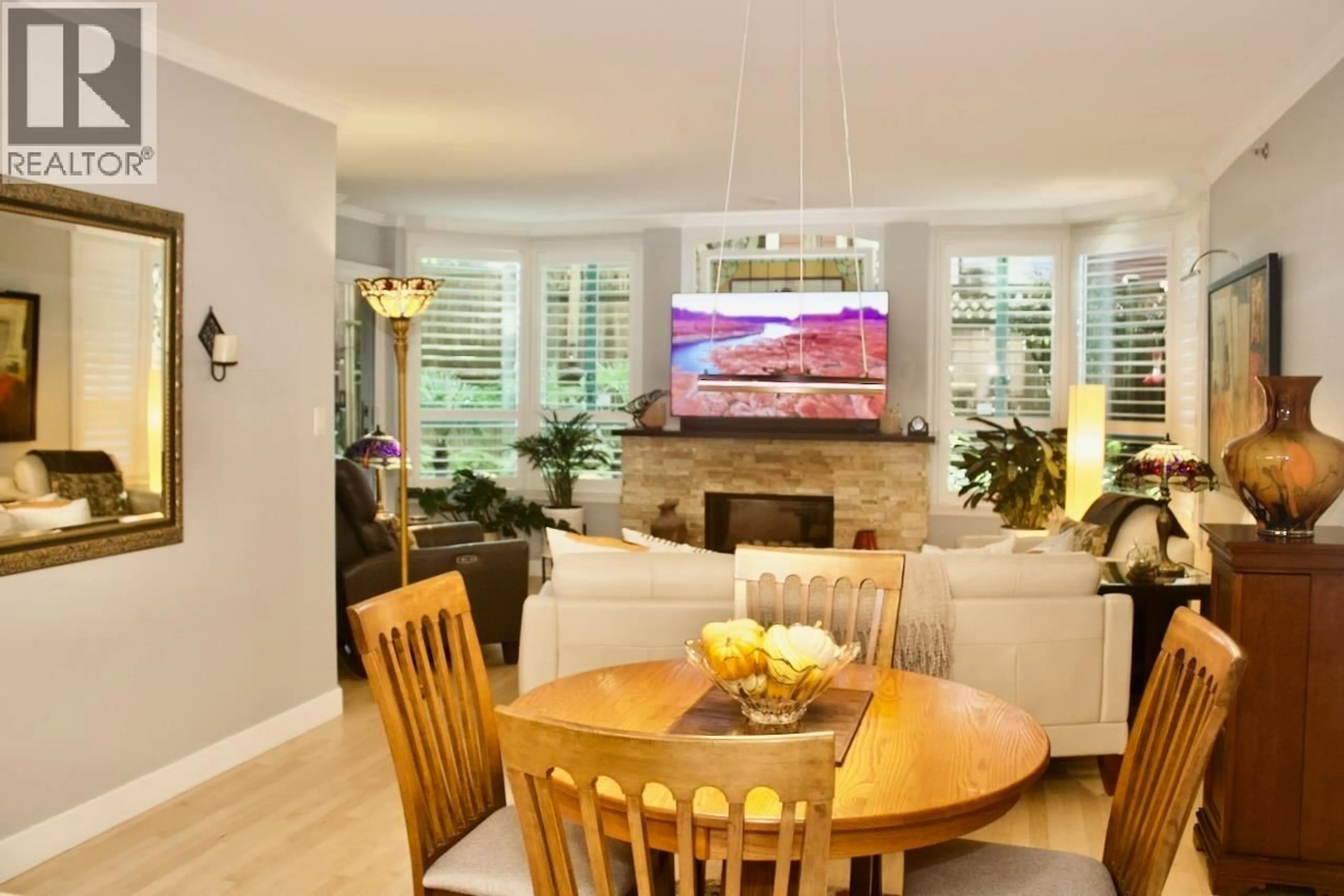 Living room with furniture, wood/laminate floor for 102 - 1132 HARO STREET, Vancouver British Columbia V6E1C9