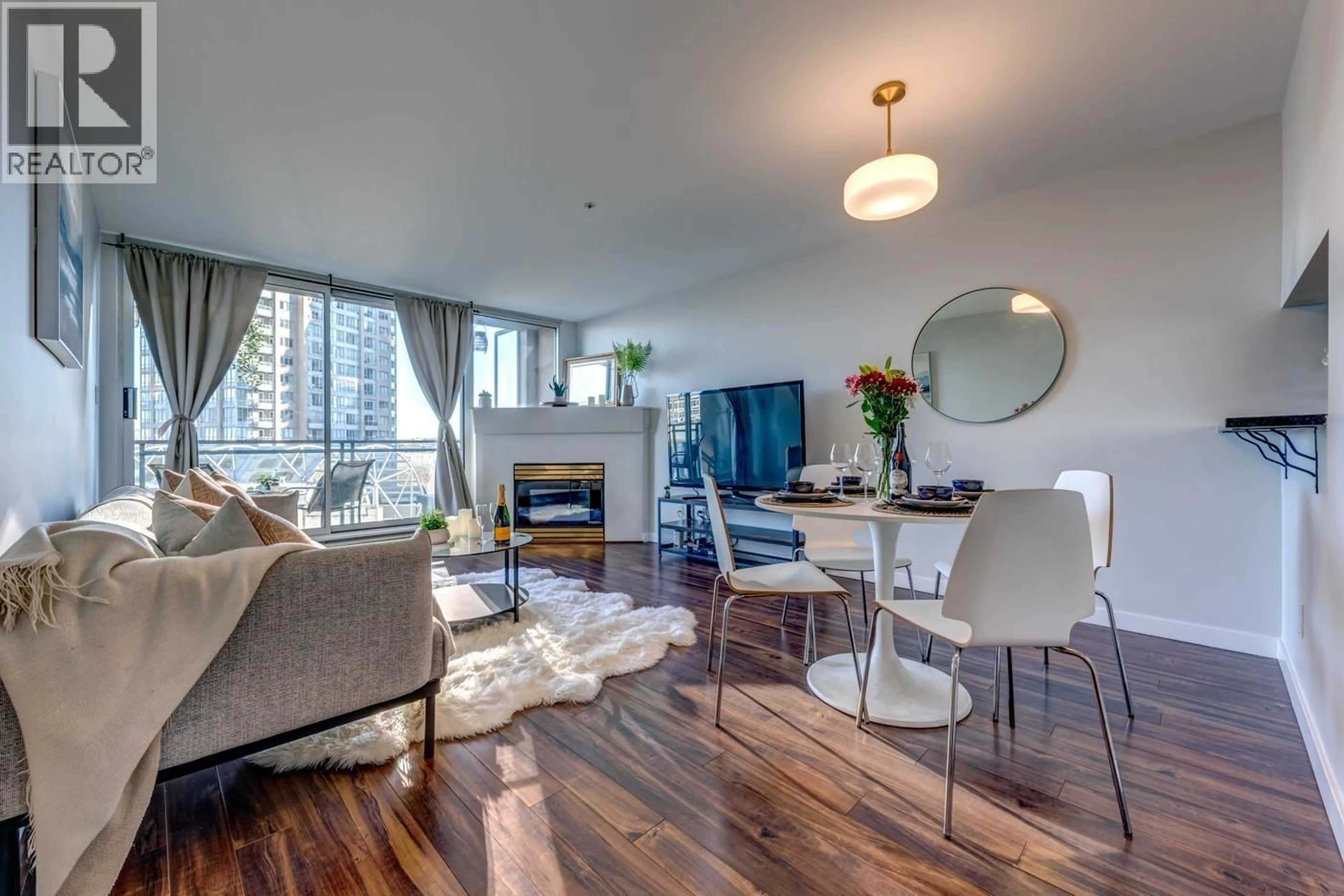 Living room with furniture, wood/laminate floor for 809 - 555 ABBOTT STREET, Vancouver British Columbia V6B6B8