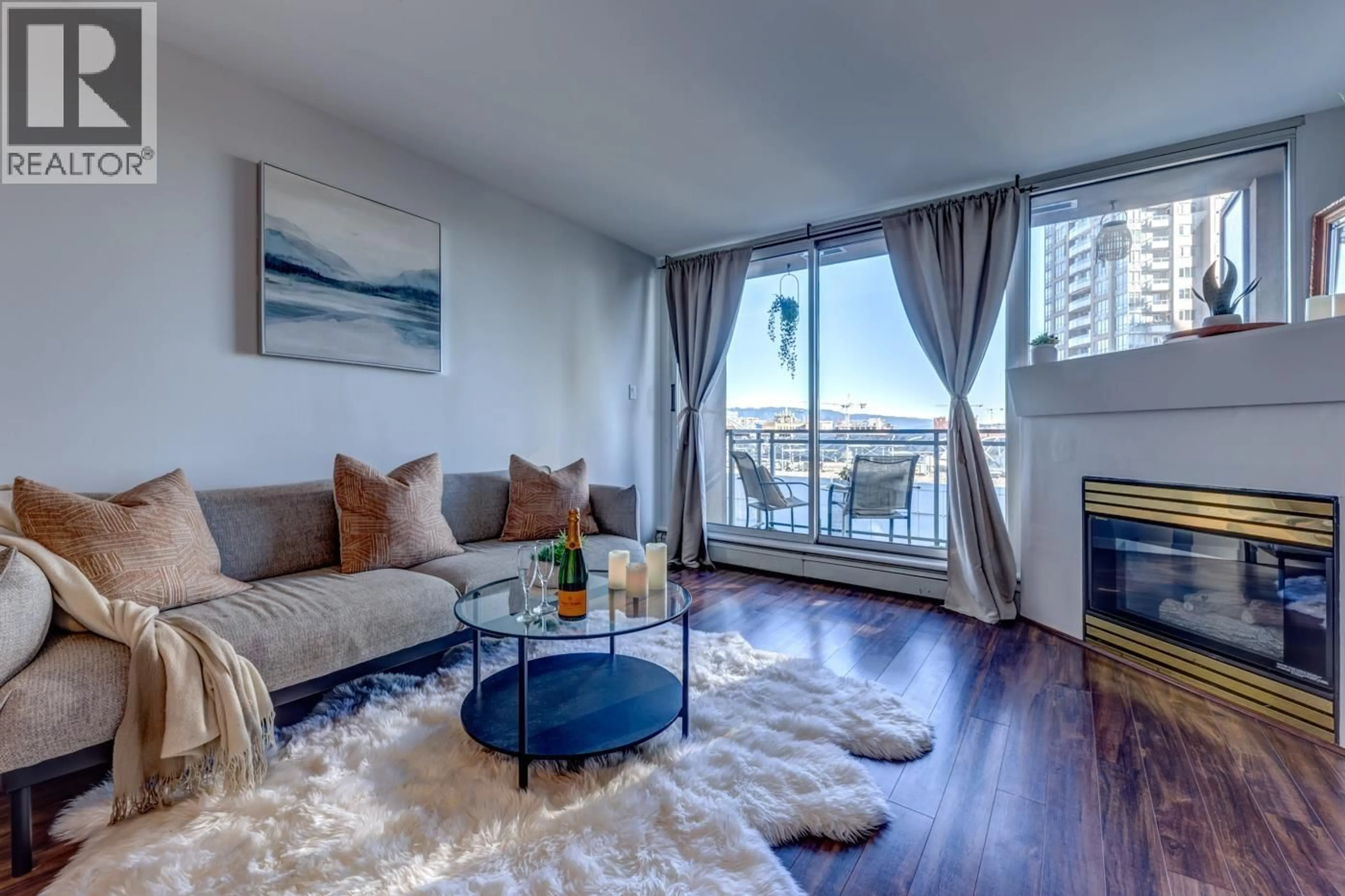 Living room with furniture, wood/laminate floor for 809 - 555 ABBOTT STREET, Vancouver British Columbia V6B6B8