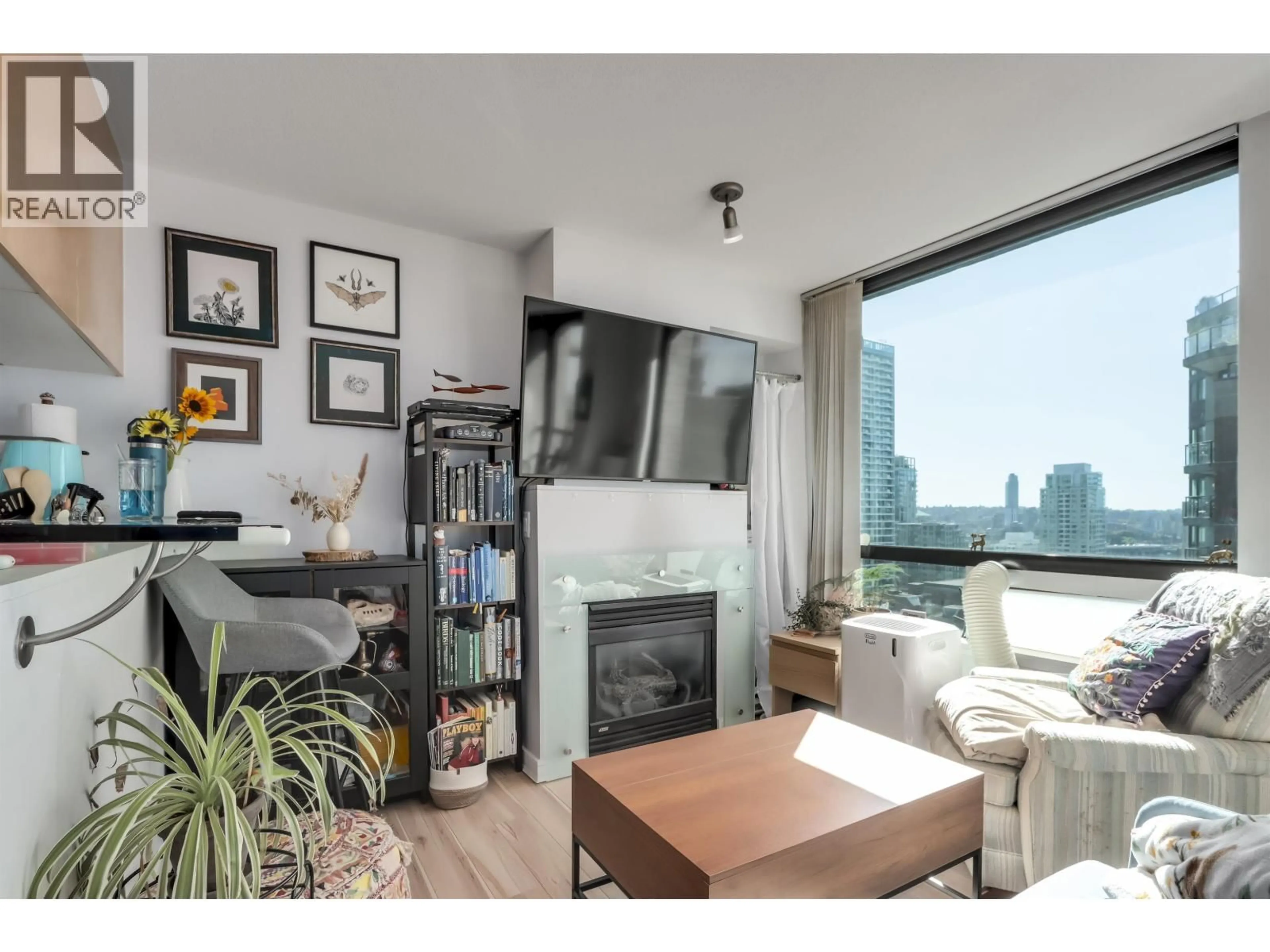 Living room with furniture, wood/laminate floor for 1406 - 1003 BURNABY STREET, Vancouver British Columbia V6E4R7