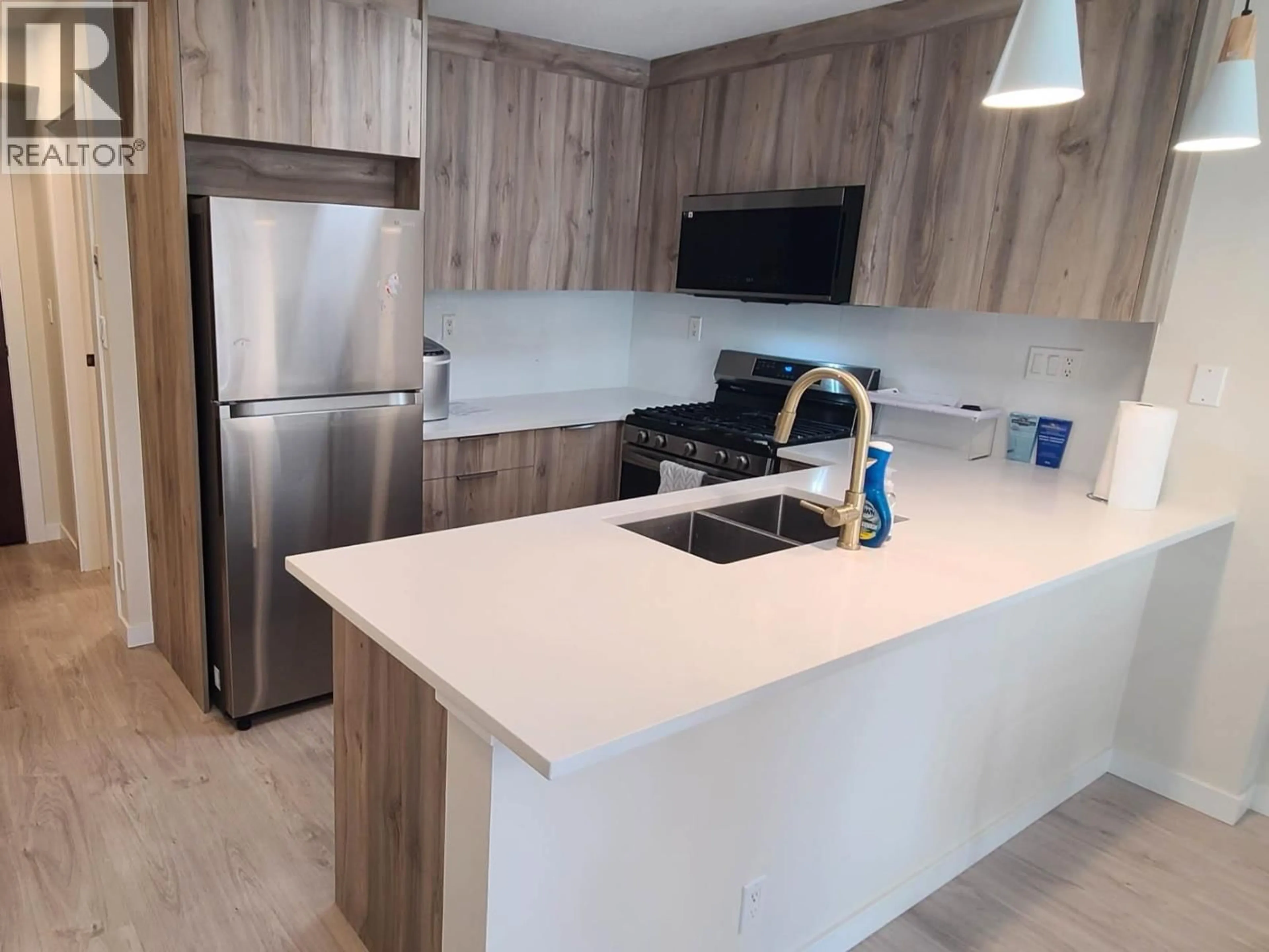 Open concept kitchen, wood/laminate floor for 512 - 7831 WESTMINSTER HIGHWAY, Richmond British Columbia V6X1A4