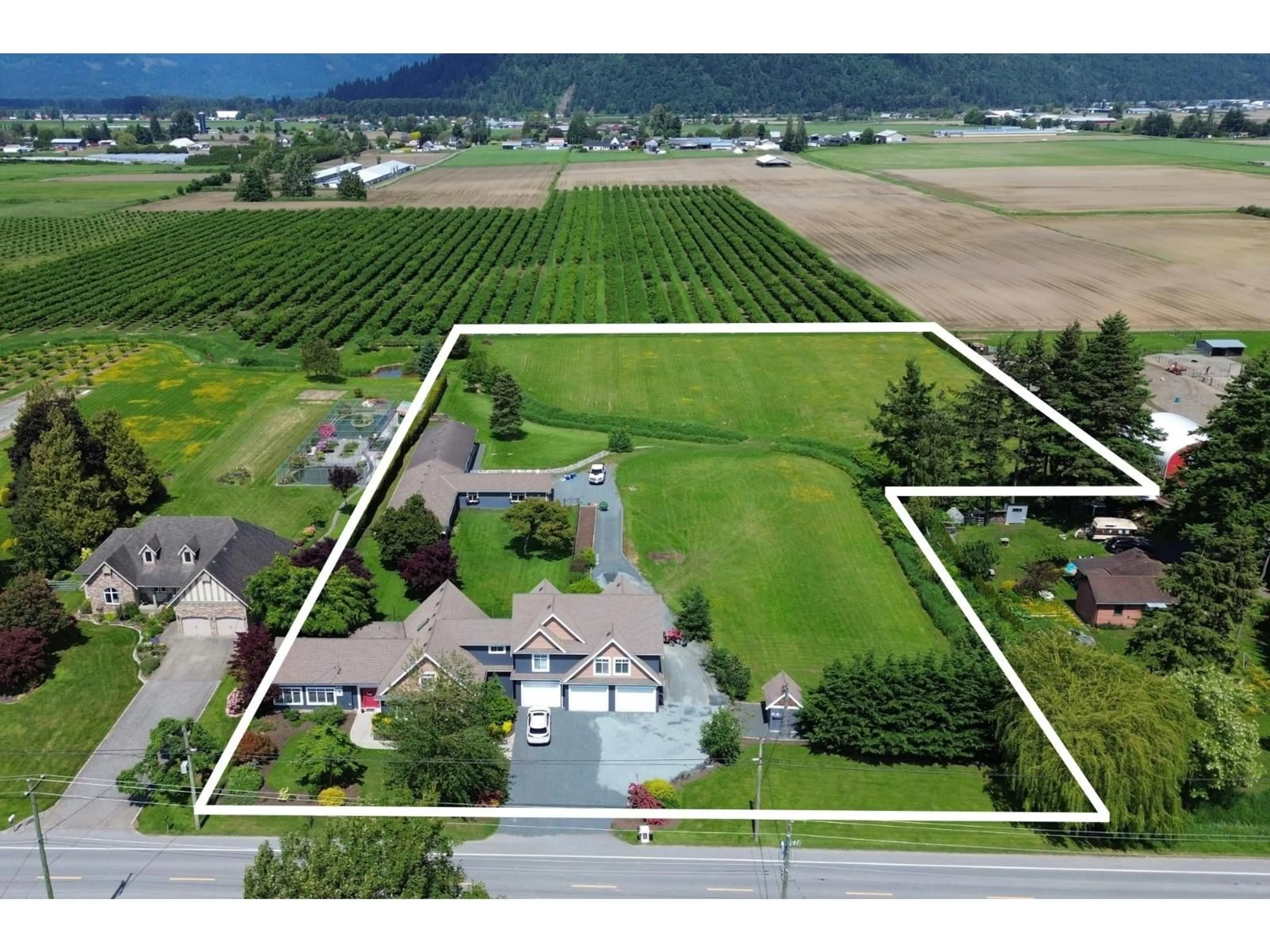 A pic from outside/outdoor area/front of a property/back of a property/a pic from drone, mountain view for 42919 SOUTH SUMAS ROAD, Chilliwack British Columbia V2R4L7