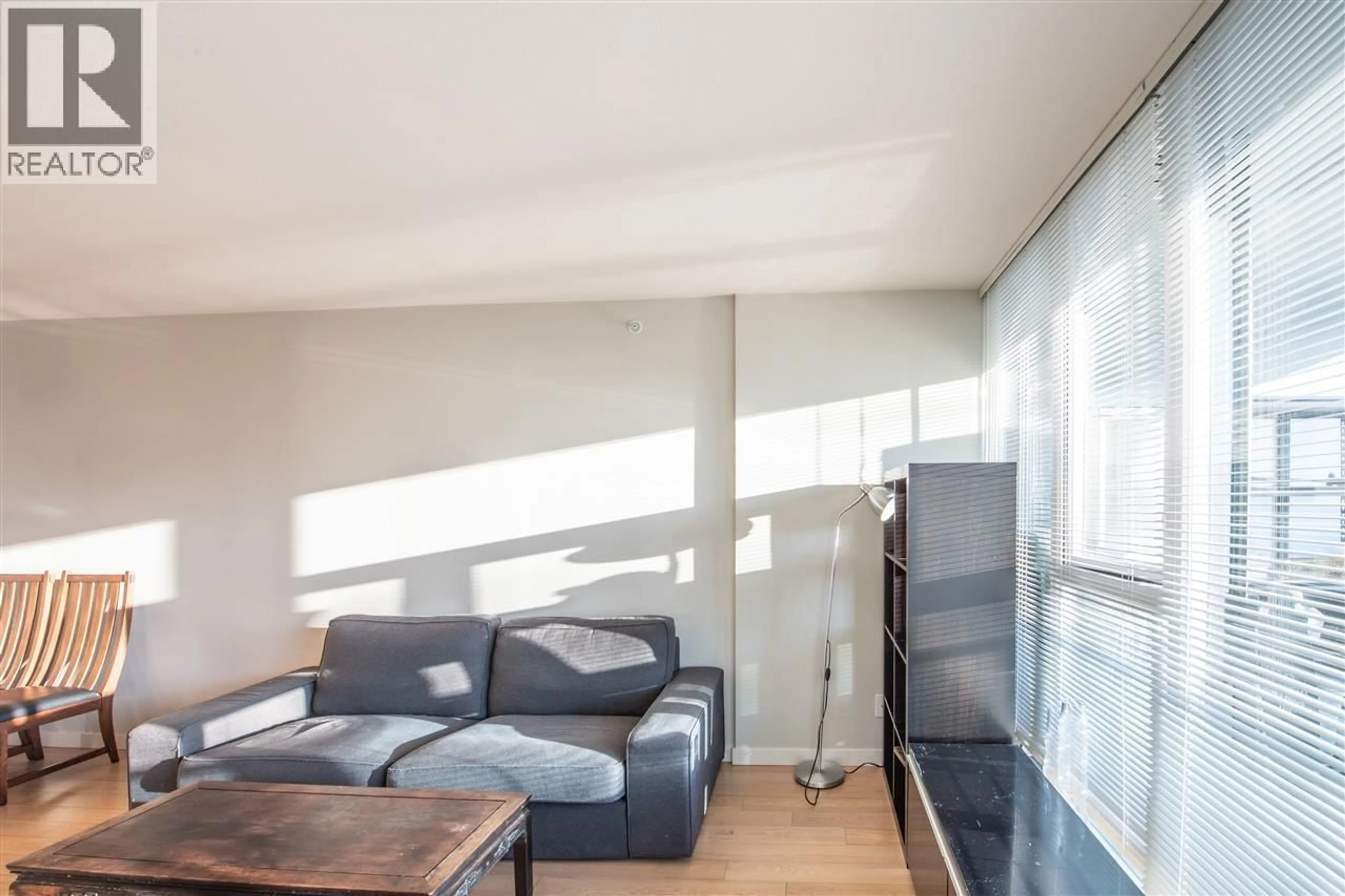 Living room with furniture, wood/laminate floor for 308 - 7117 ELMBRIDGE WAY, Richmond British Columbia V6X0J2