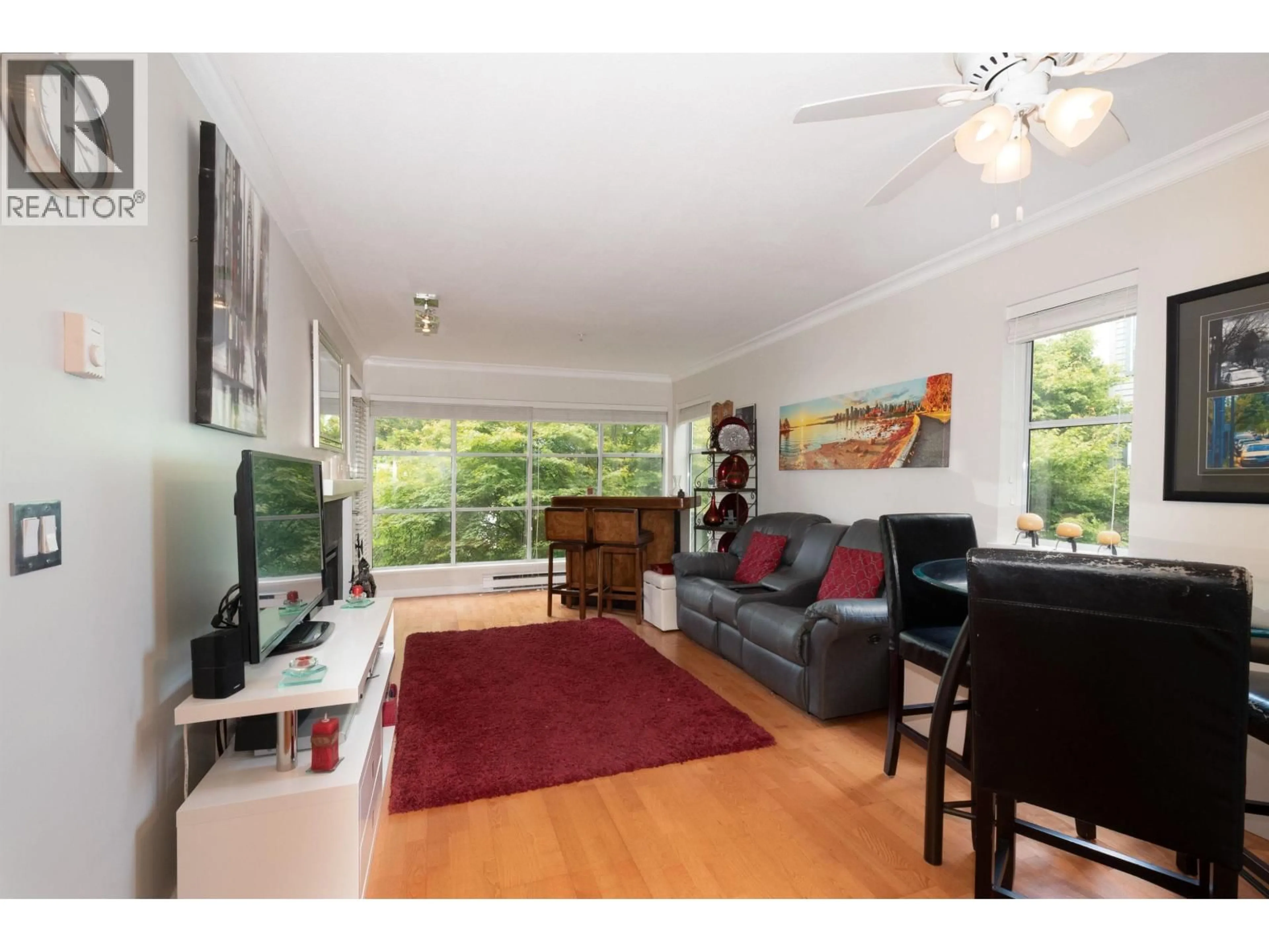 Living room with furniture, wood/laminate floor for 304 - 2250 3RD AVENUE, Vancouver British Columbia V6K1L4