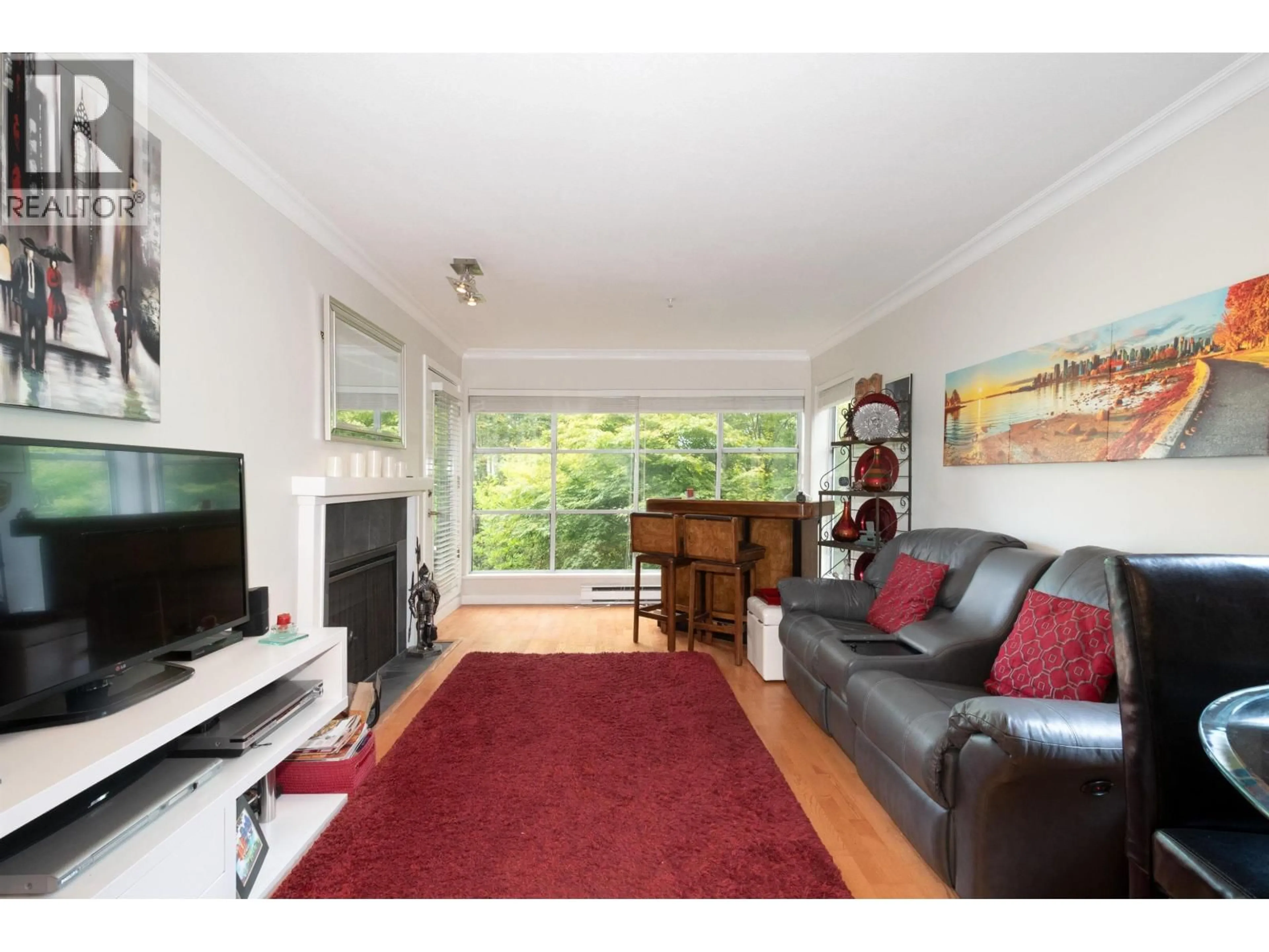 Living room with furniture, wood/laminate floor for 304 - 2250 3RD AVENUE, Vancouver British Columbia V6K1L4