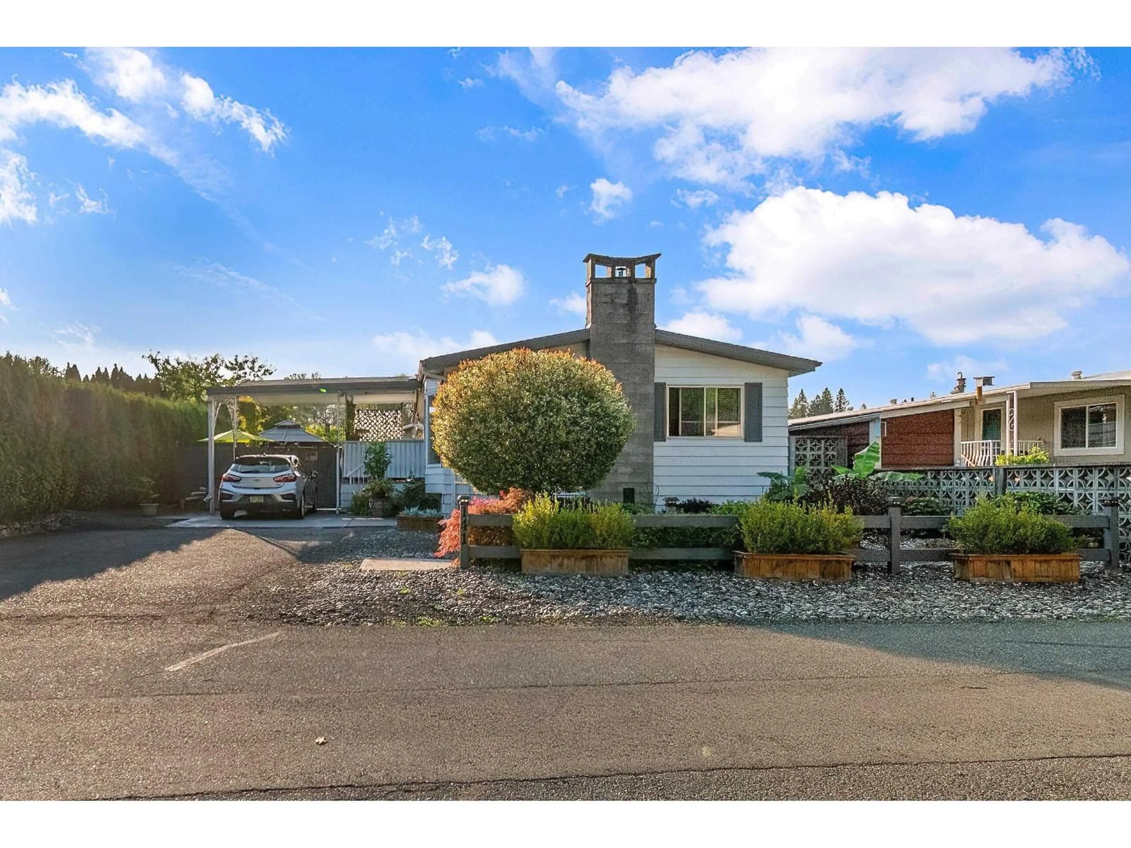 A pic from outside/outdoor area/front of a property/back of a property/a pic from drone, street for 141 - 46511 CHILLIWACK LAKE ROAD, Chilliwack British Columbia V2R3S4