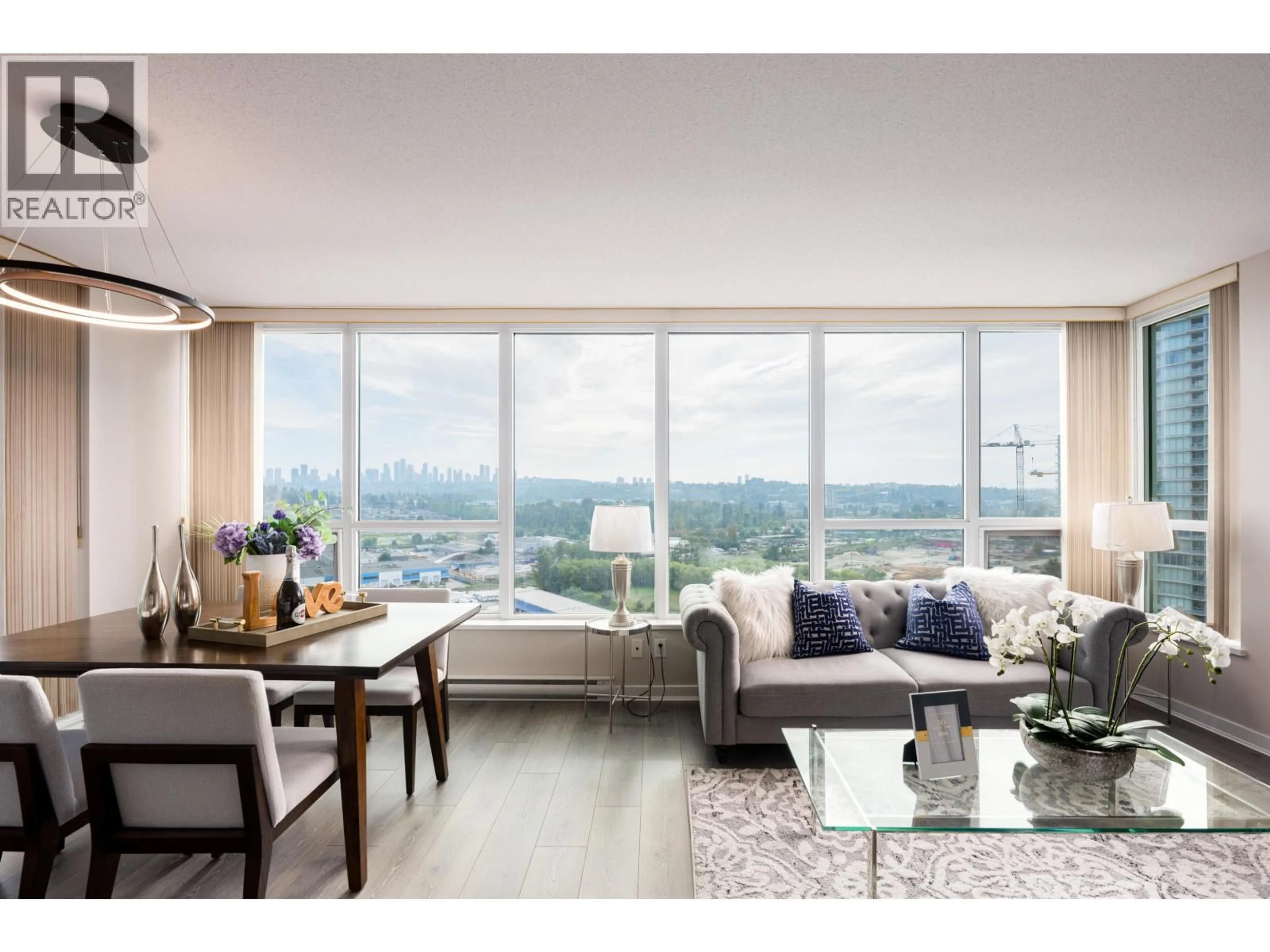 Living room with furniture, wood/laminate floor for 1403 - 2200 DOUGLAS ROAD, Burnaby British Columbia V5C0G8