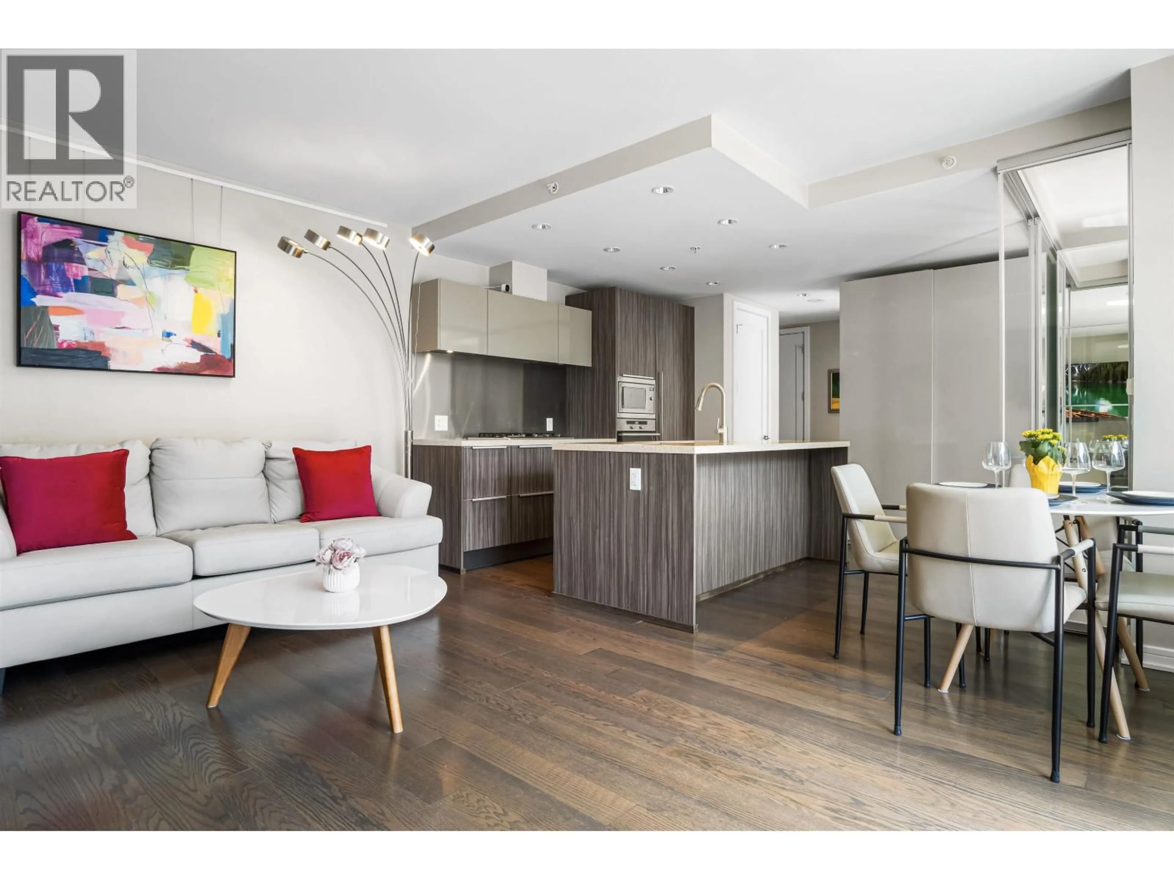 Open concept kitchen, wood/laminate floor for 709 - 77 WALTER HARDWICK AVENUE, Vancouver British Columbia V5Y0C6