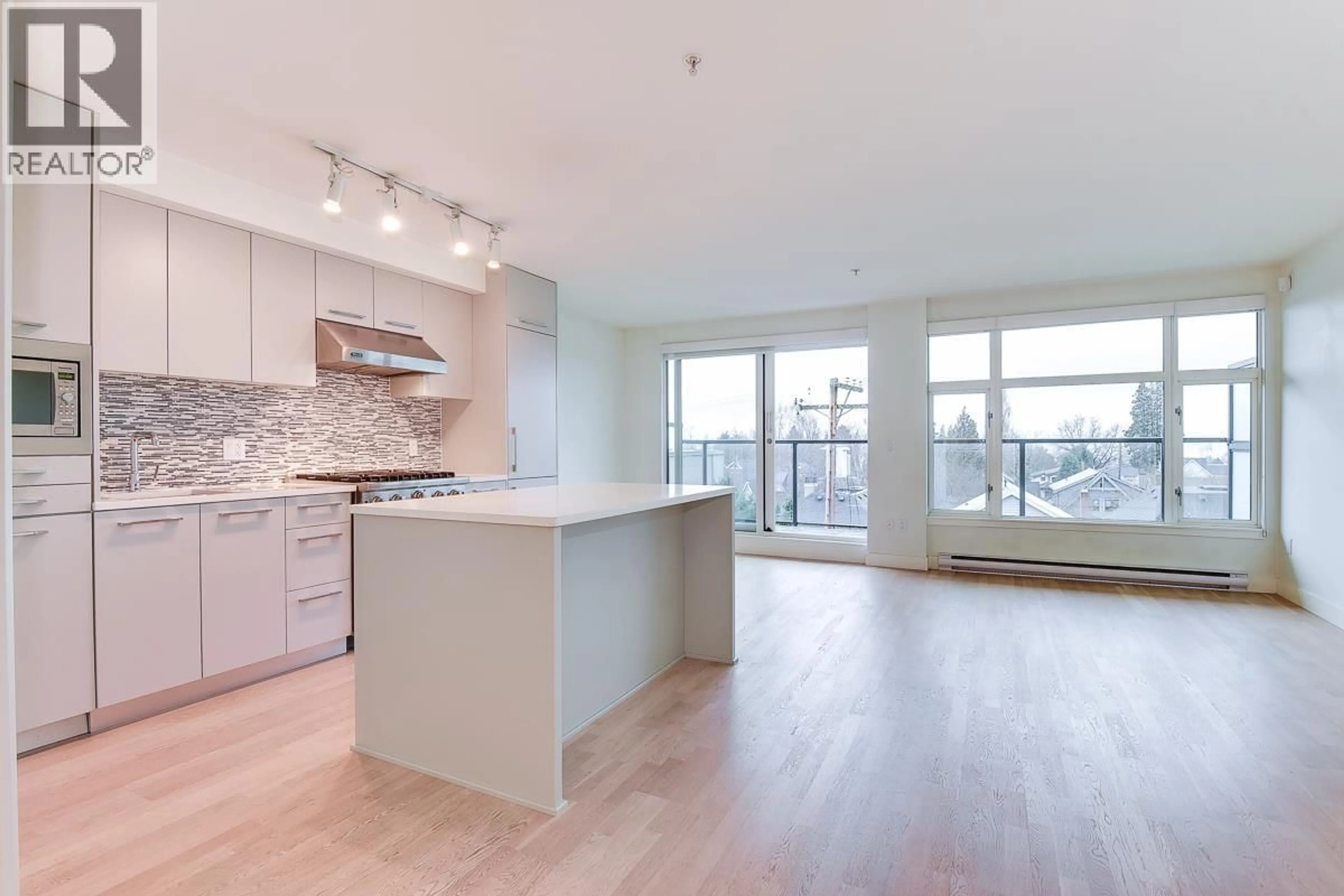 Open concept kitchen, wood/laminate floor for 309 - 4355 W 10TH AVENUE, Vancouver British Columbia V6R2H6