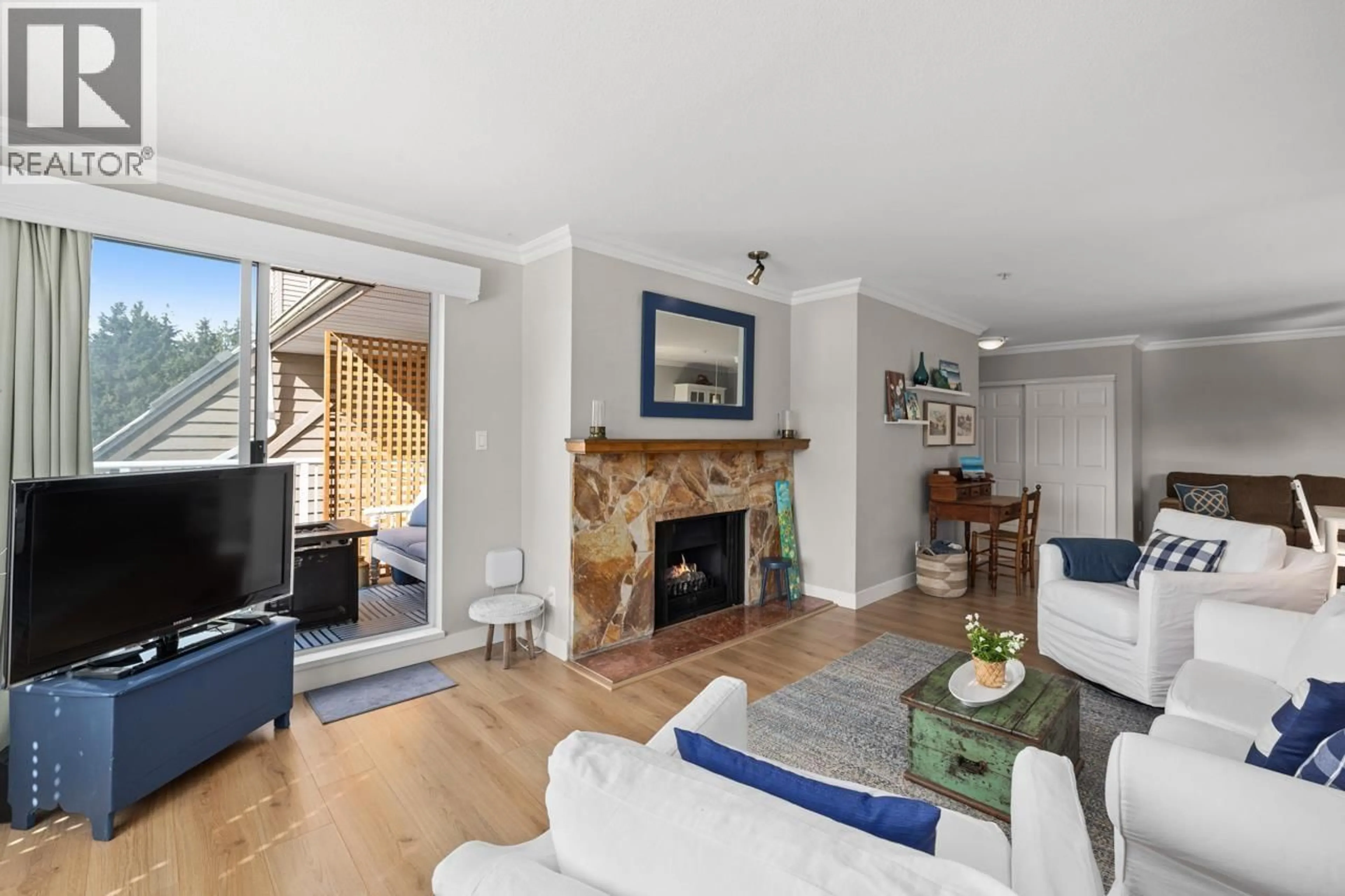 Living room with furniture, wood/laminate floor for 610 - 1000 BOWRON COURT, North Vancouver British Columbia V7H2W1