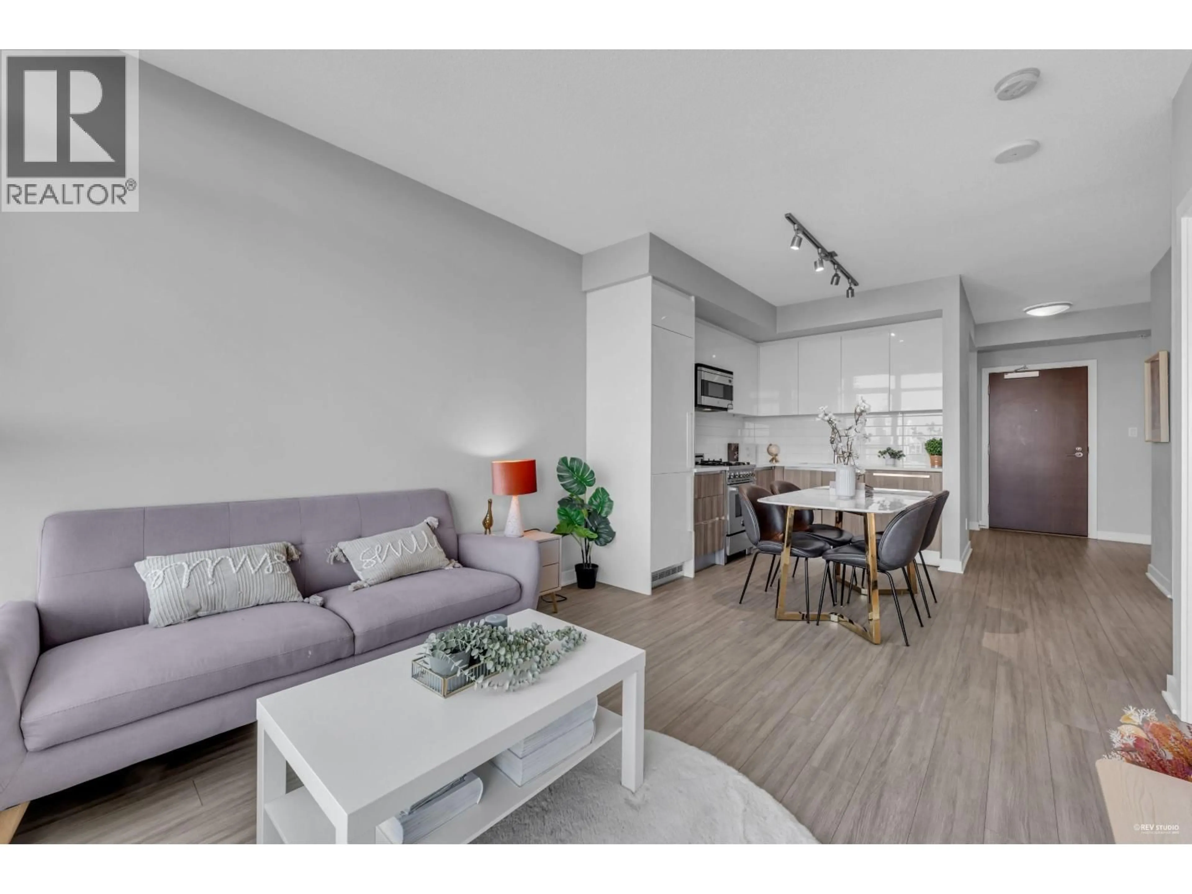 Living room with furniture, wood/laminate floor for 3002 - 4900 LENNOX LANE, Burnaby British Columbia V5H0G9