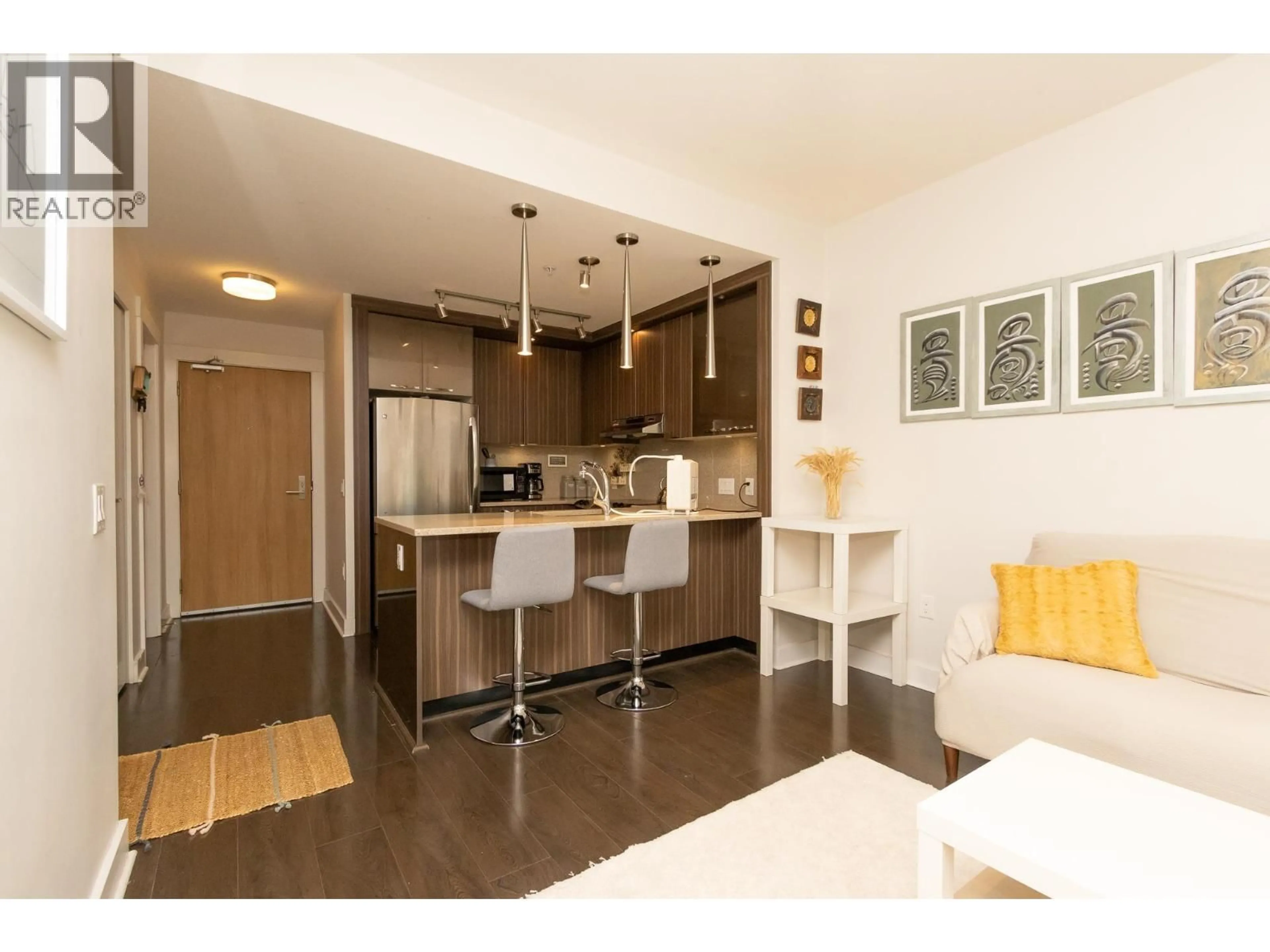 Open concept kitchen, wood/laminate floor for 310 - 733 14TH STREET, North Vancouver British Columbia V7M0C6