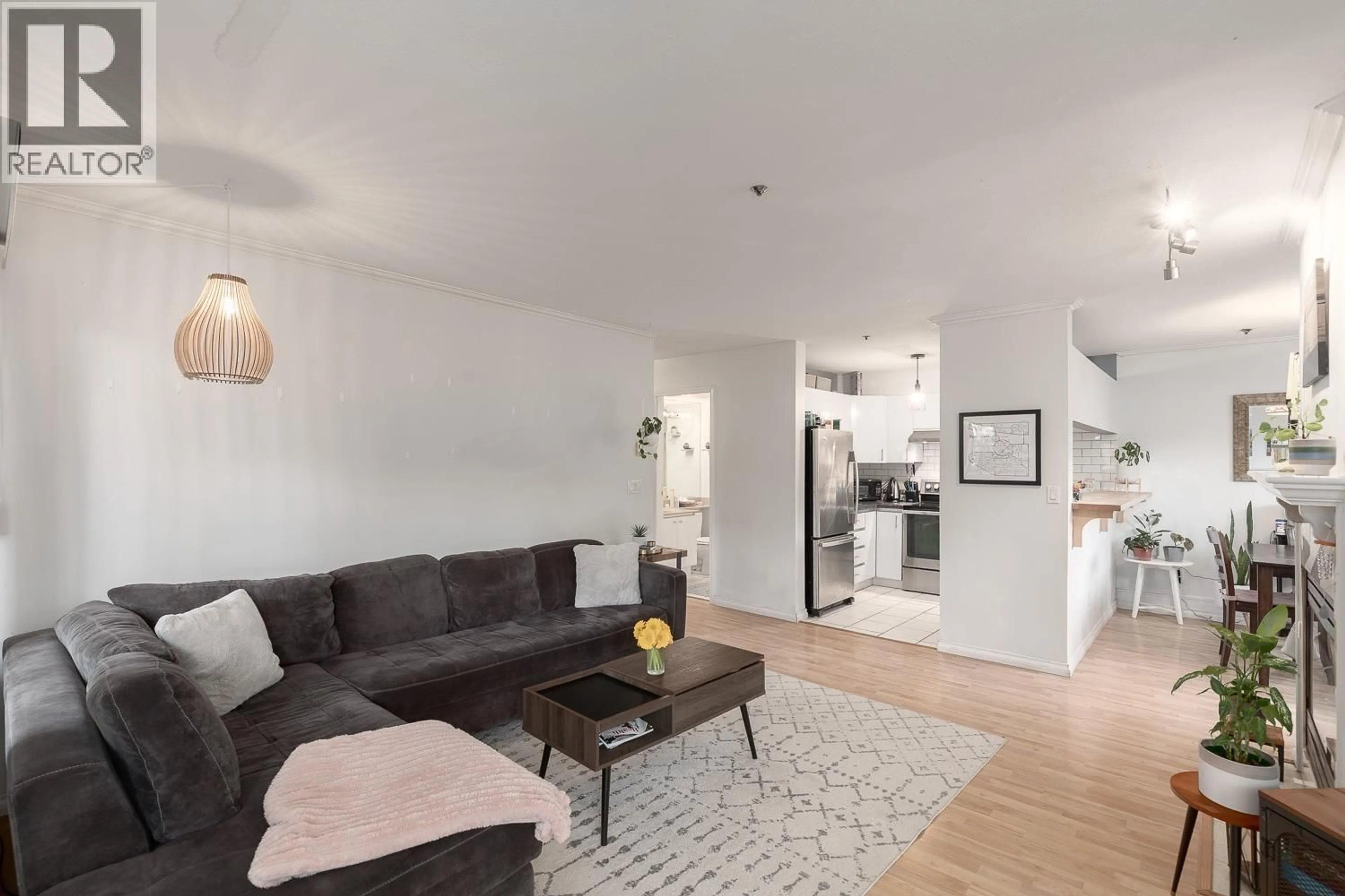 Living room with furniture, wood/laminate floor for 102 - 838 16TH AVENUE, Vancouver British Columbia V5Z1T1