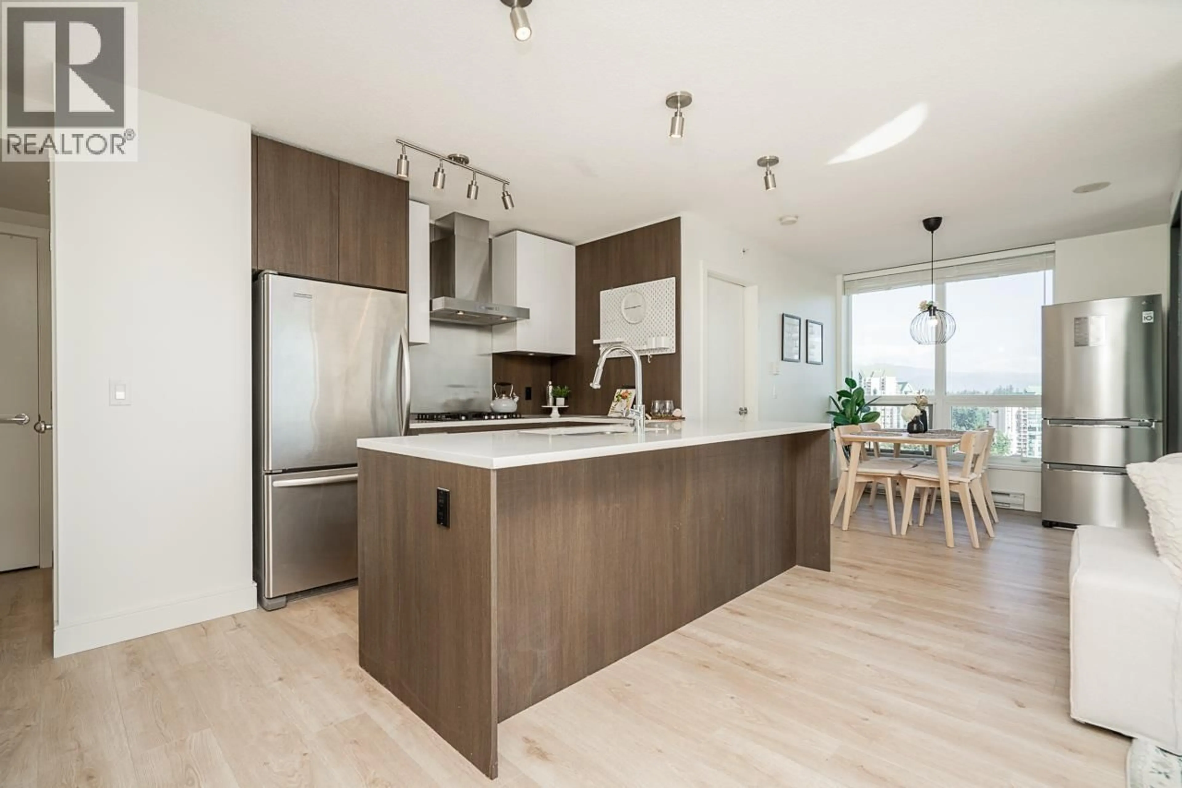 Open concept kitchen, wood/laminate floor for 2203 - 3007 GLEN DRIVE, Coquitlam British Columbia V3B0L8