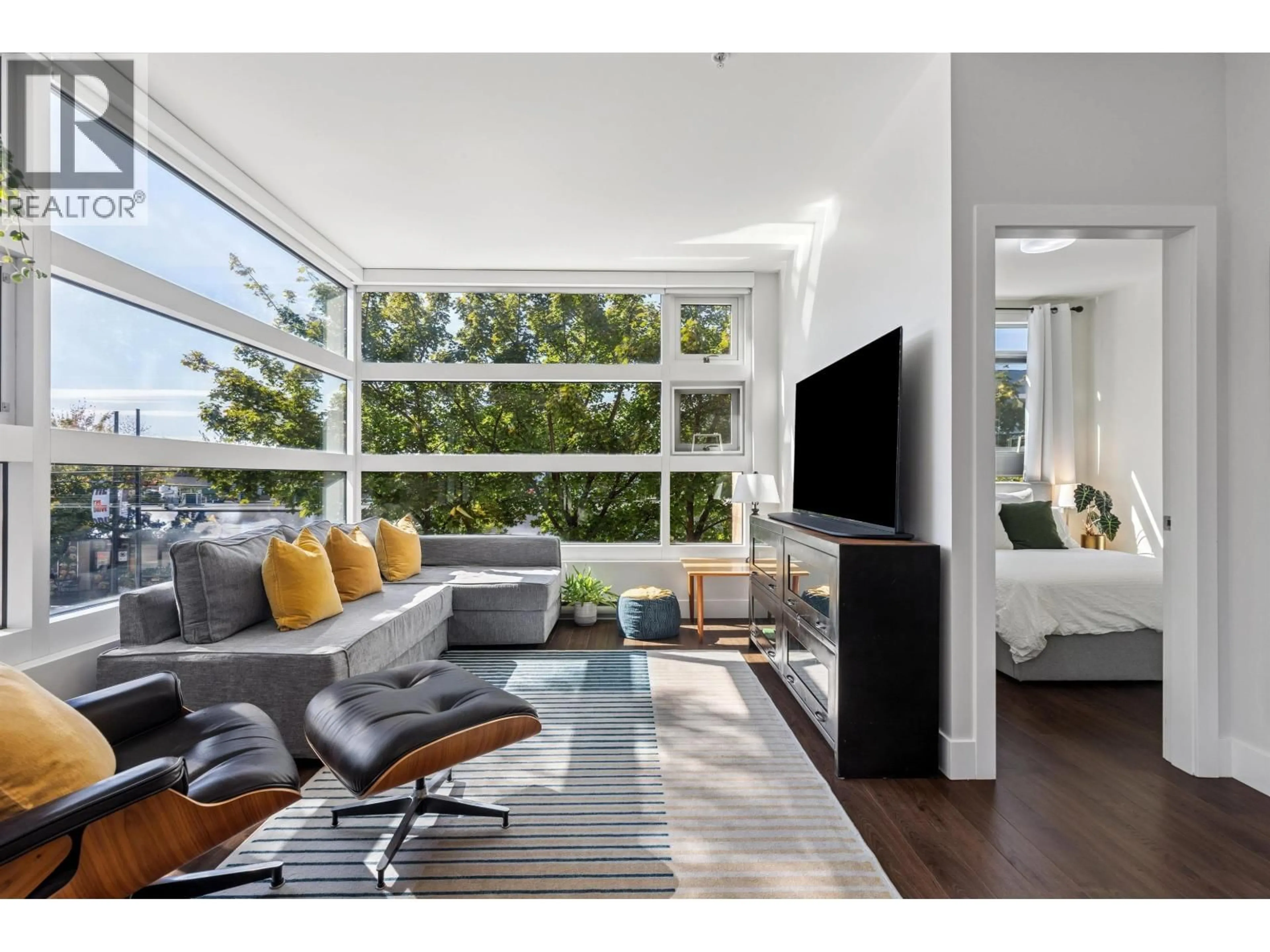 Living room with furniture, unknown for 214 - 2250 COMMERCIAL DRIVE, Vancouver British Columbia V5N5P9
