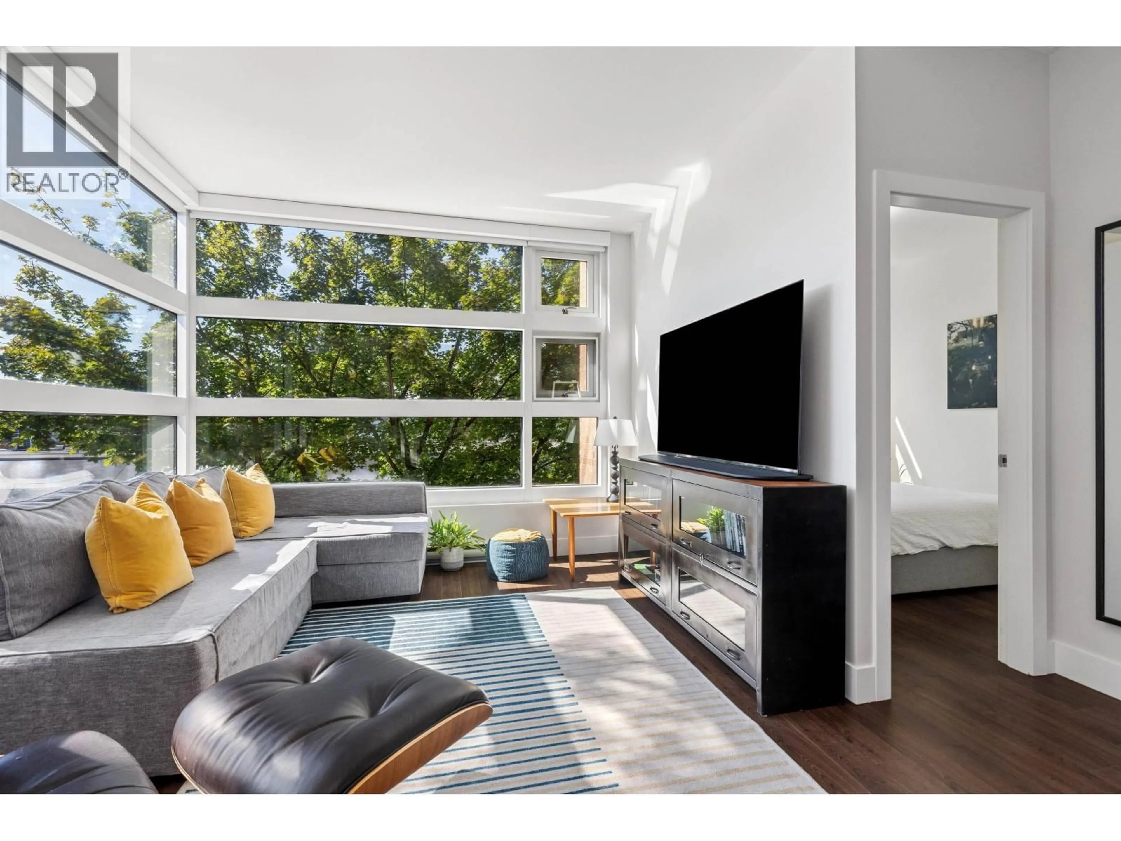 Living room with furniture, unknown for 214 - 2250 COMMERCIAL DRIVE, Vancouver British Columbia V5N5P9