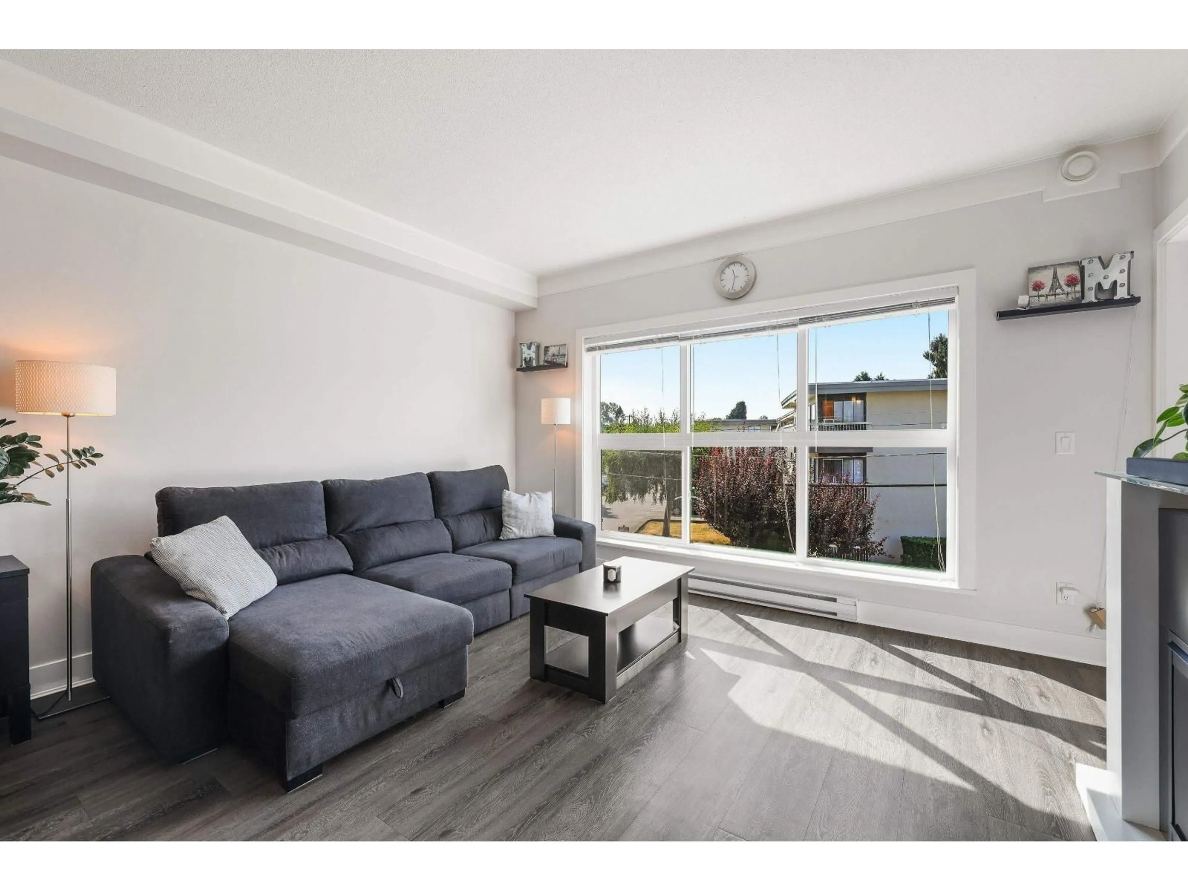 Living room with furniture, wood/laminate floor for 207 - 20630 DOUGLAS, Langley British Columbia V3A4B8