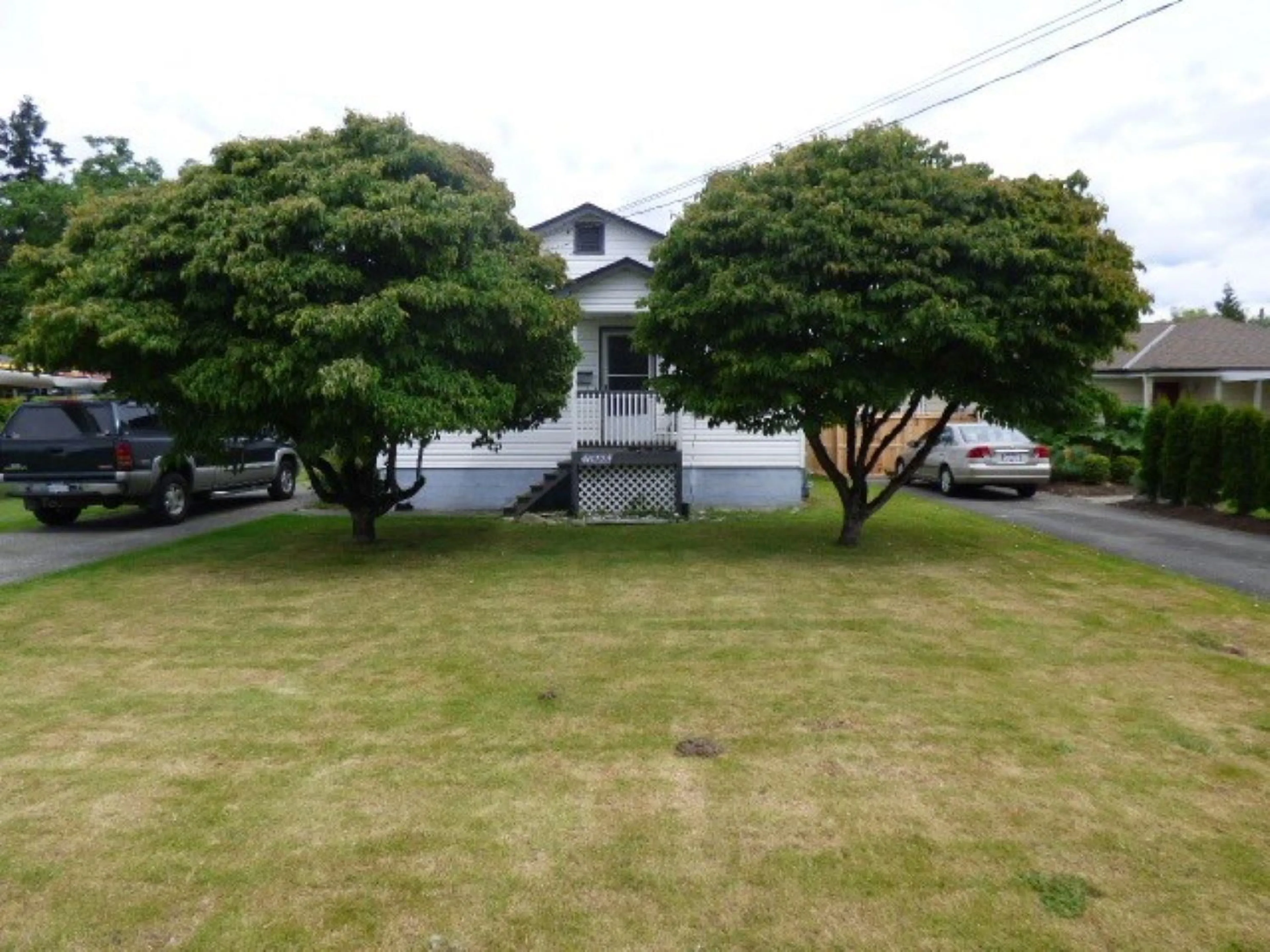 A pic from outside/outdoor area/front of a property/back of a property/a pic from drone, unknown for 46223 RIVERSIDE DRIVE, Chilliwack British Columbia V2P3L2