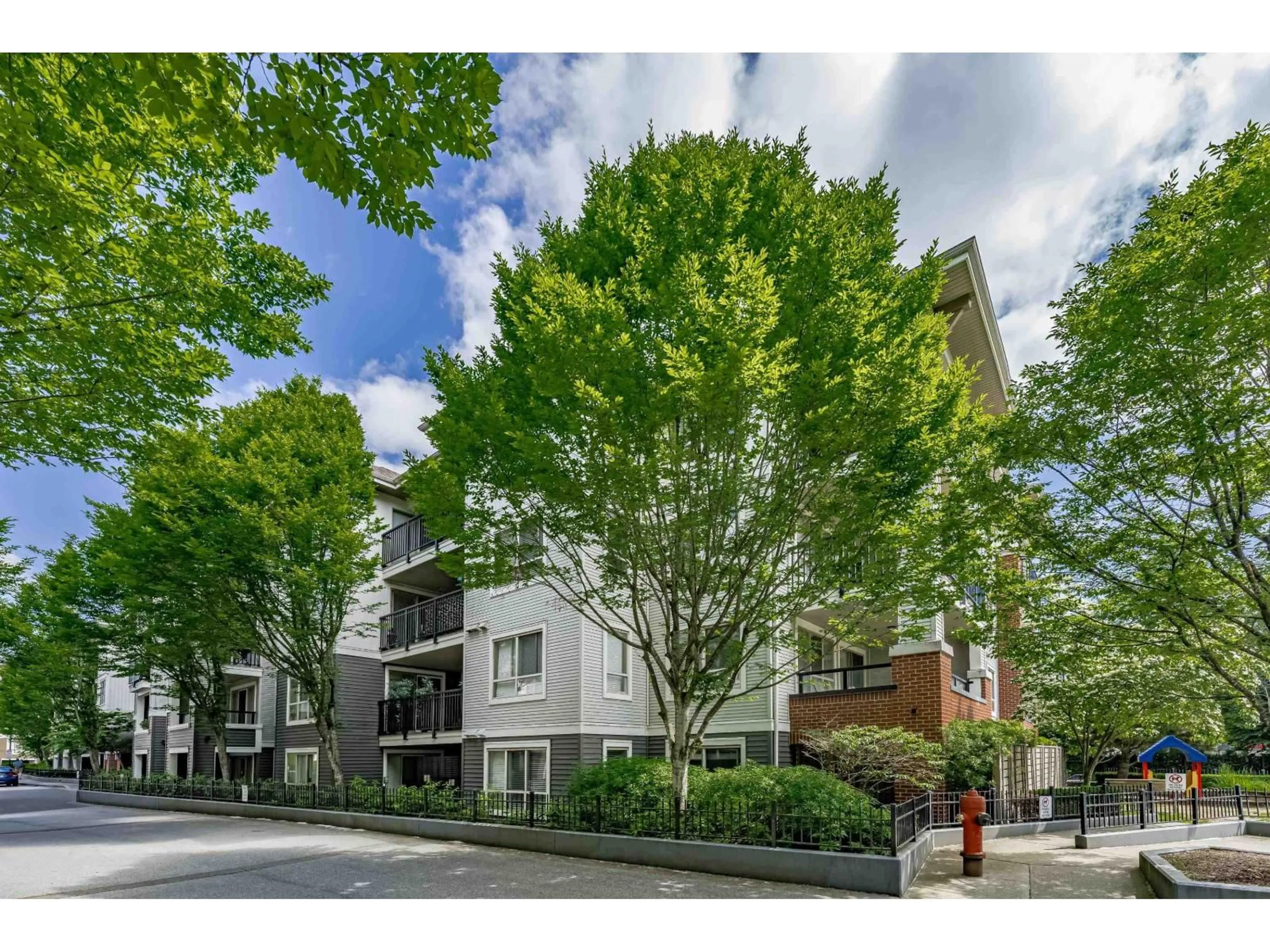 A pic from outside/outdoor area/front of a property/back of a property/a pic from drone, street for A304 - 8929 202, Langley British Columbia V1M0B4