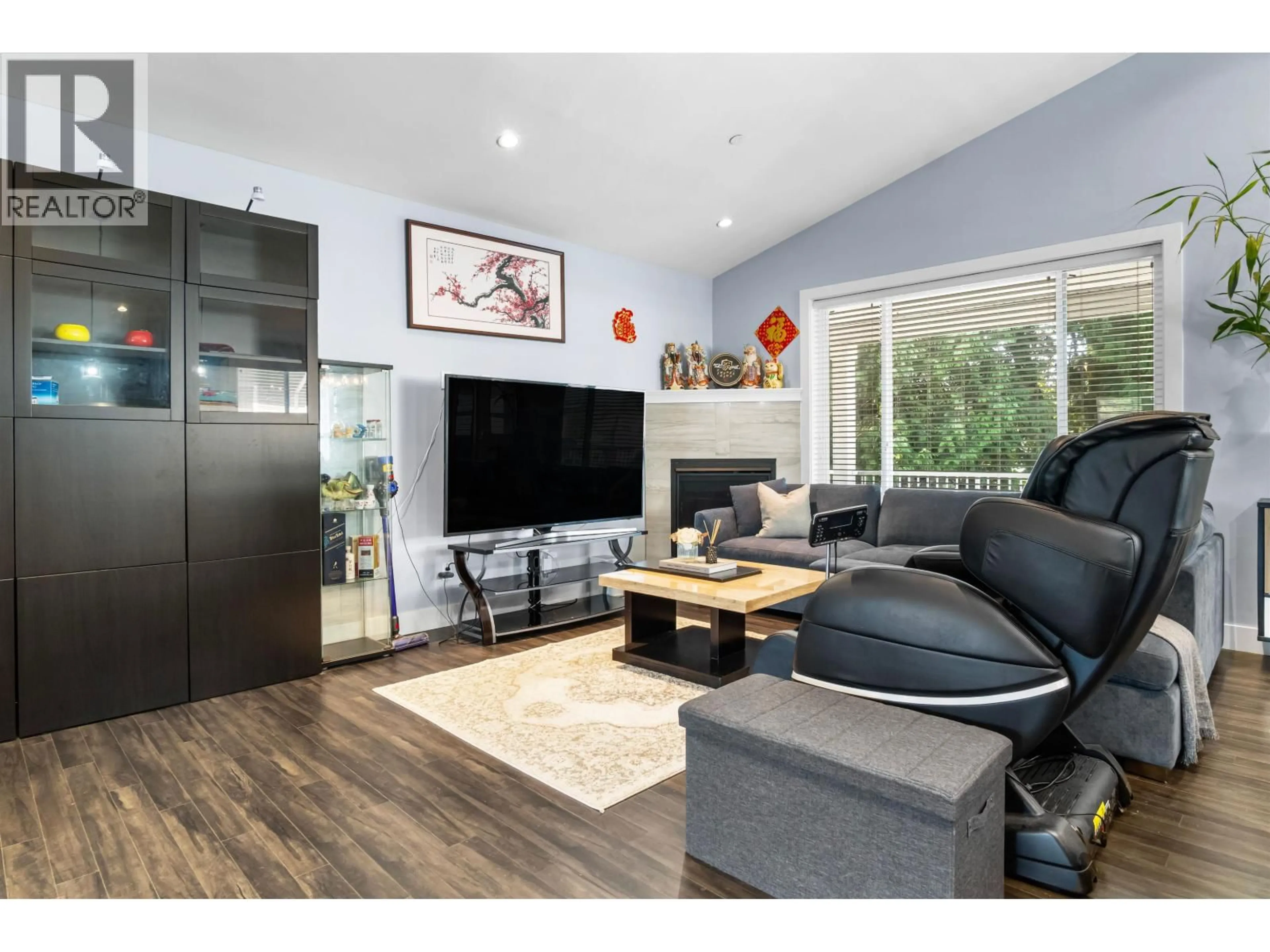 Living room with furniture, wood/laminate floor for 12265 210 STREET, Maple Ridge British Columbia V2X8B9