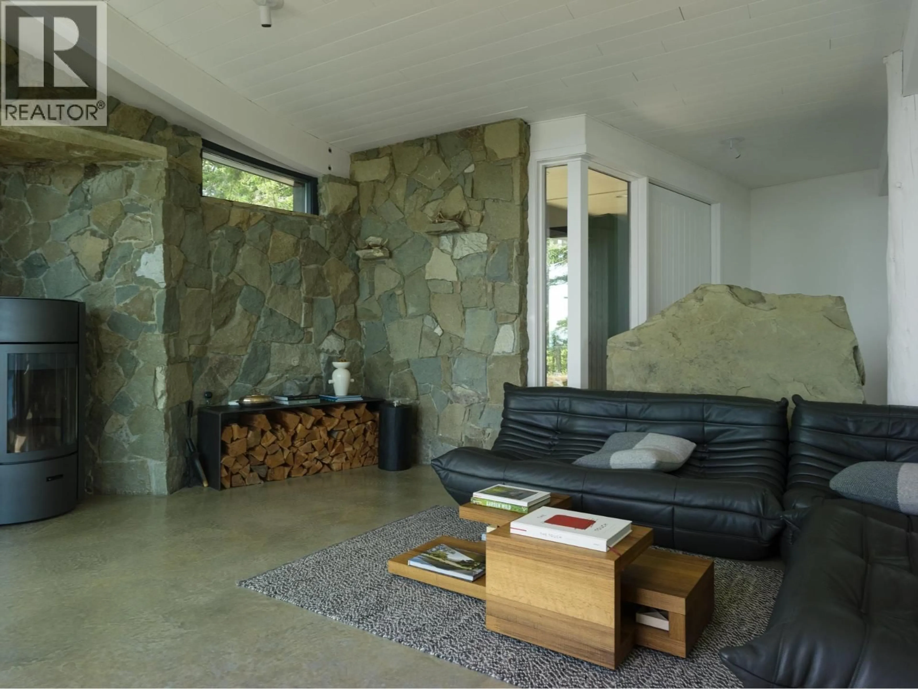 Living room with furniture, cement floor for 630 TINKER ROAD, Mayne Island British Columbia V0N2J2