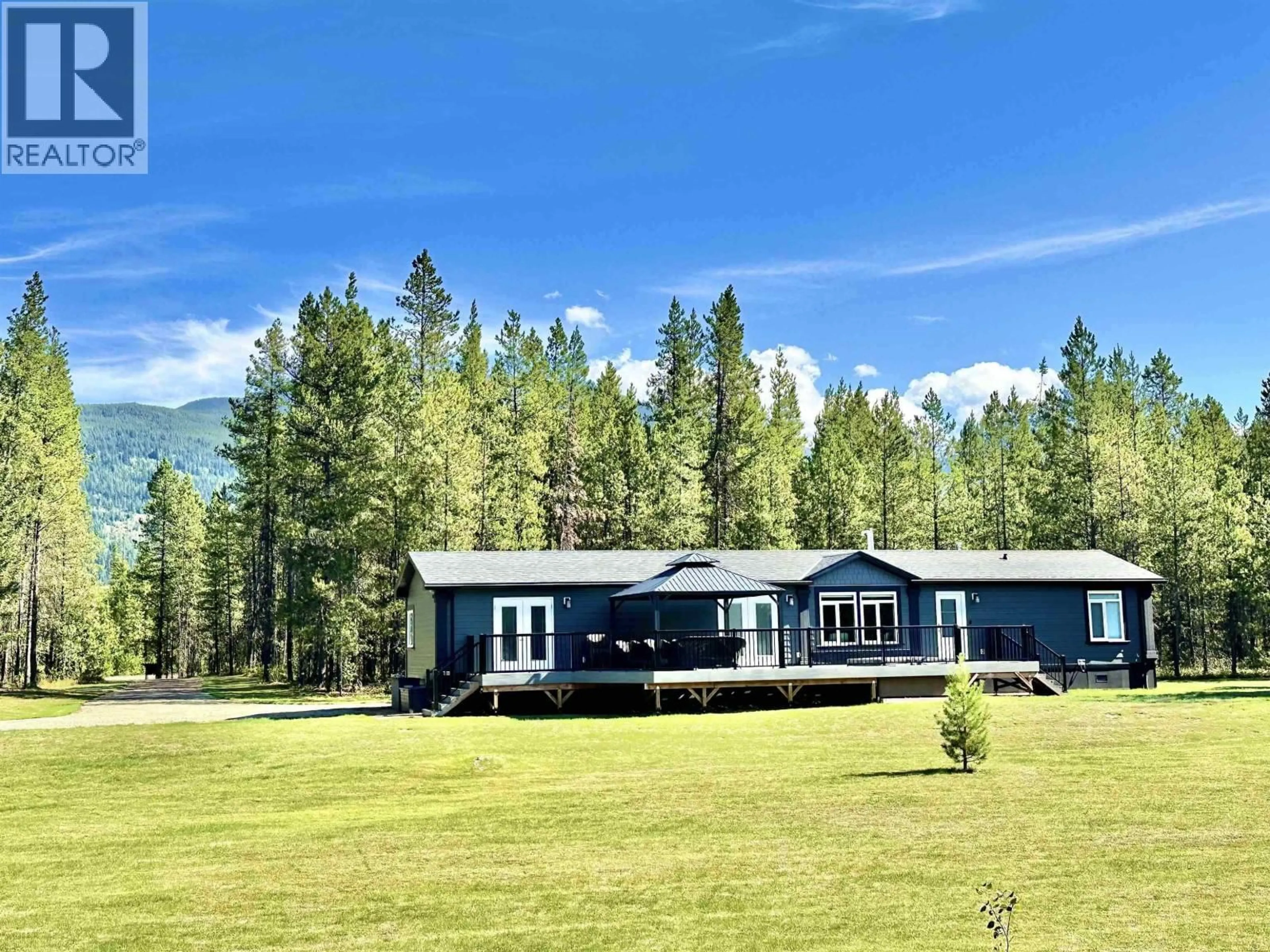 A pic from outside/outdoor area/front of a property/back of a property/a pic from drone, mountain view for 11975 BLACKMAN ROAD, Valemount British Columbia V0E2Z0