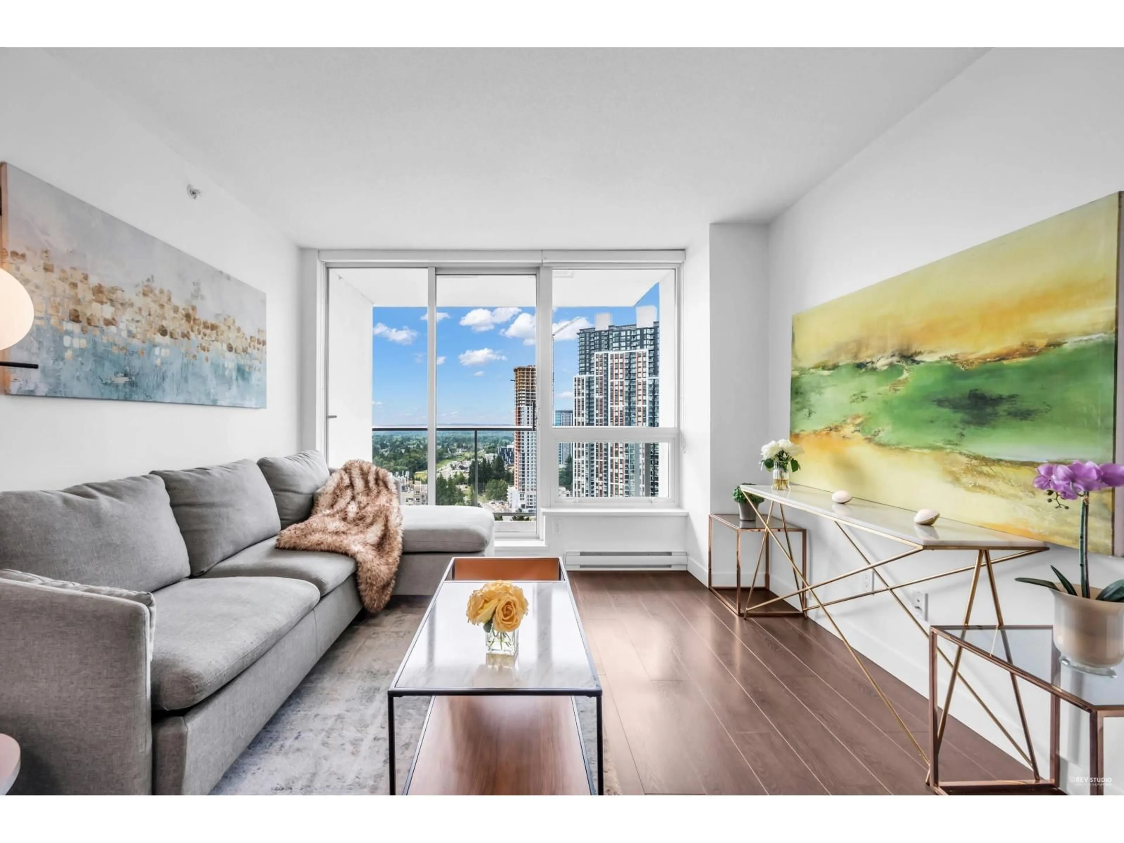 Living room with furniture, wood/laminate floor for 3205 - 13750 100, Surrey British Columbia V3T0L3