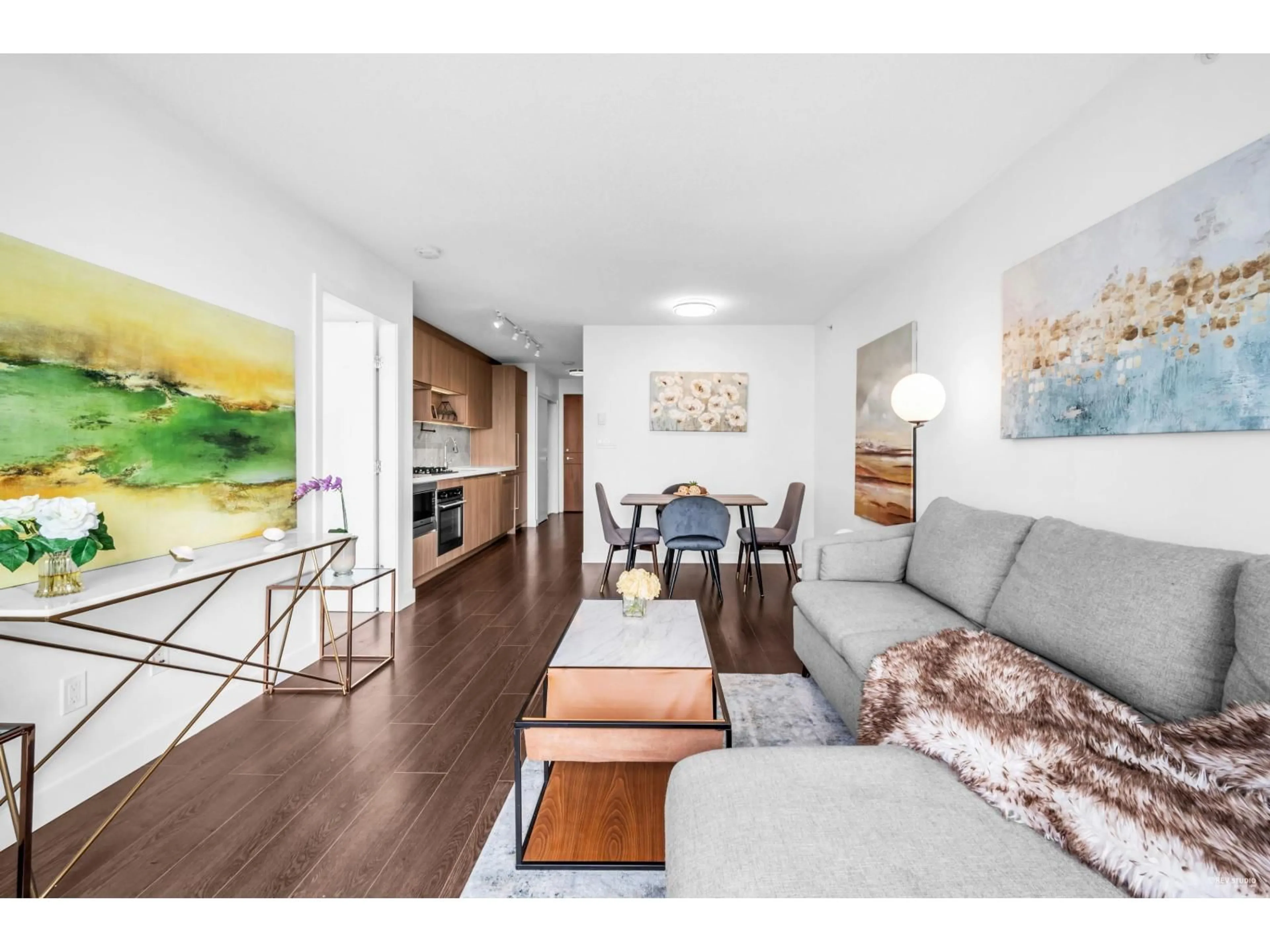 Living room with furniture, wood/laminate floor for 3205 - 13750 100, Surrey British Columbia V3T0L3