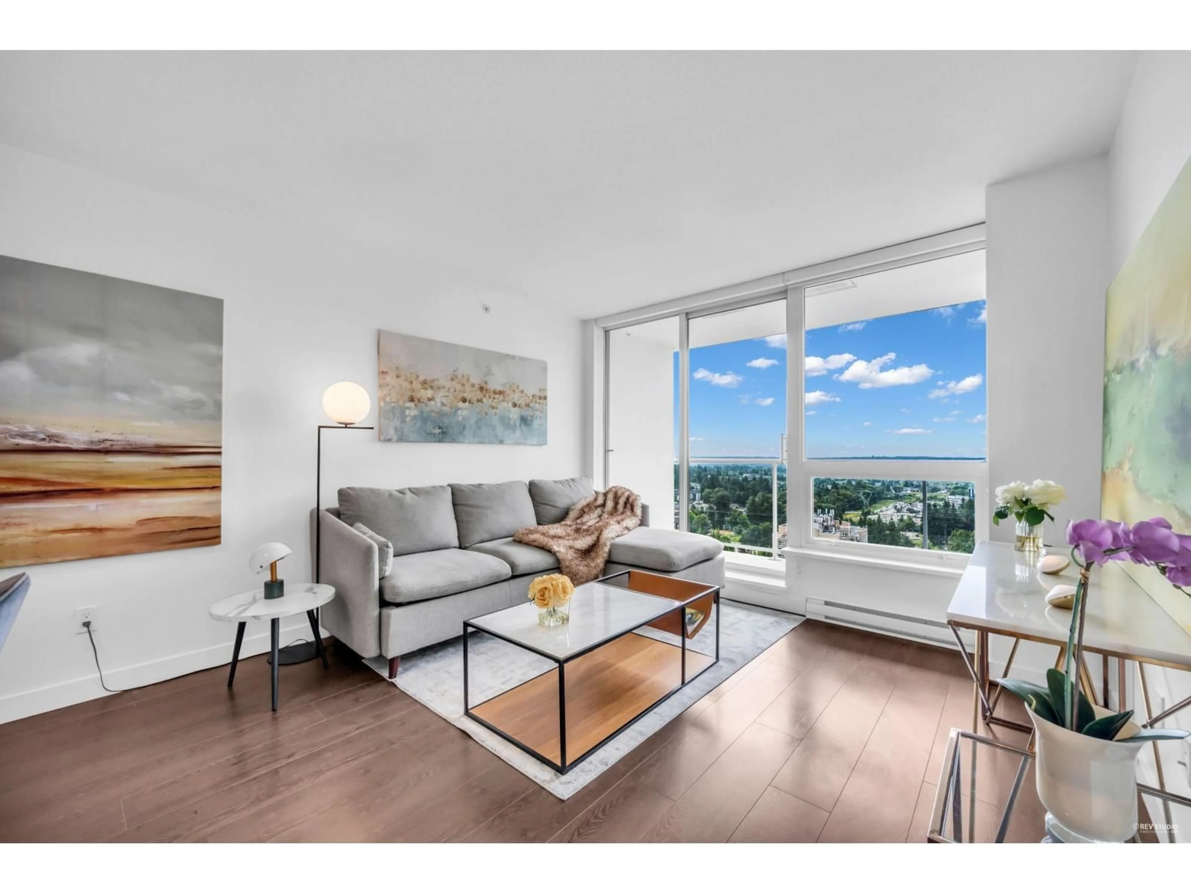 Living room with furniture, wood/laminate floor for 3205 - 13750 100, Surrey British Columbia V3T0L3