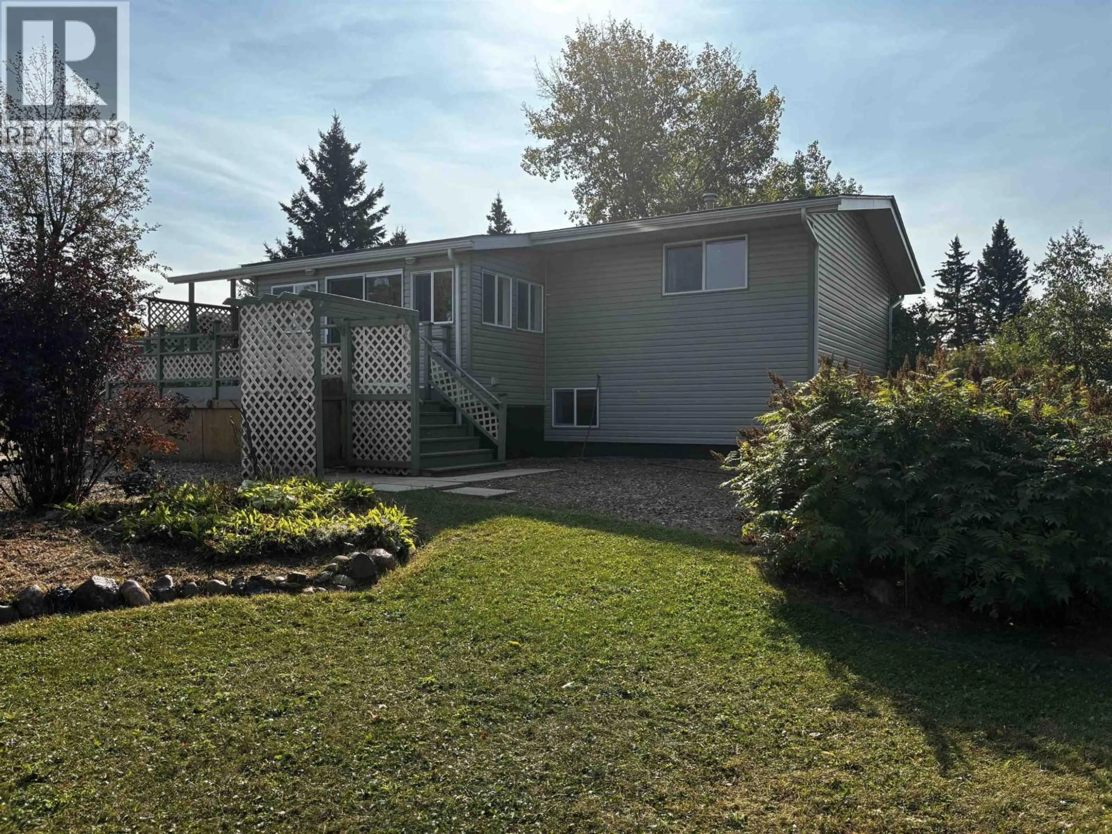 Home with vinyl exterior material, street for 6208 242 ROAD, Fort St. John British Columbia V1J8J3