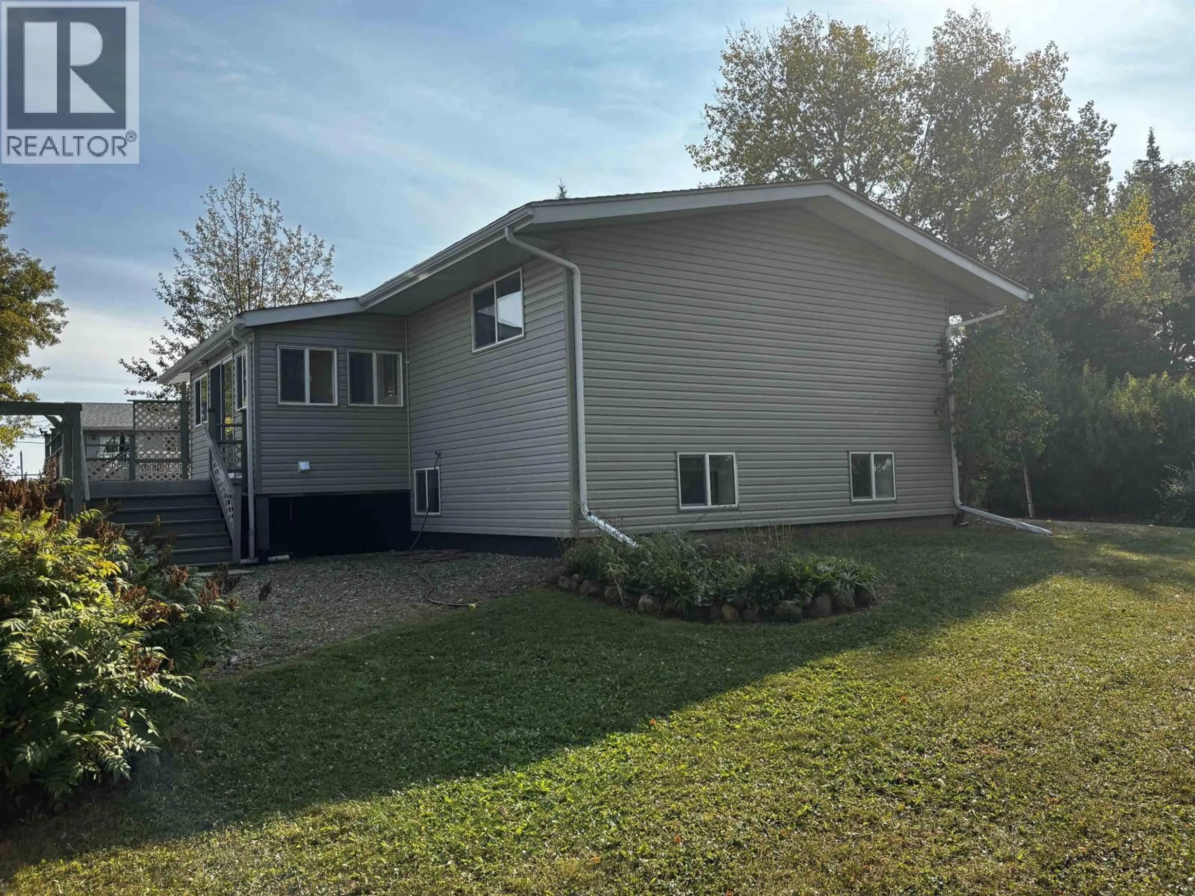 Home with vinyl exterior material, street for 6208 242 ROAD, Fort St. John British Columbia V1J8J3
