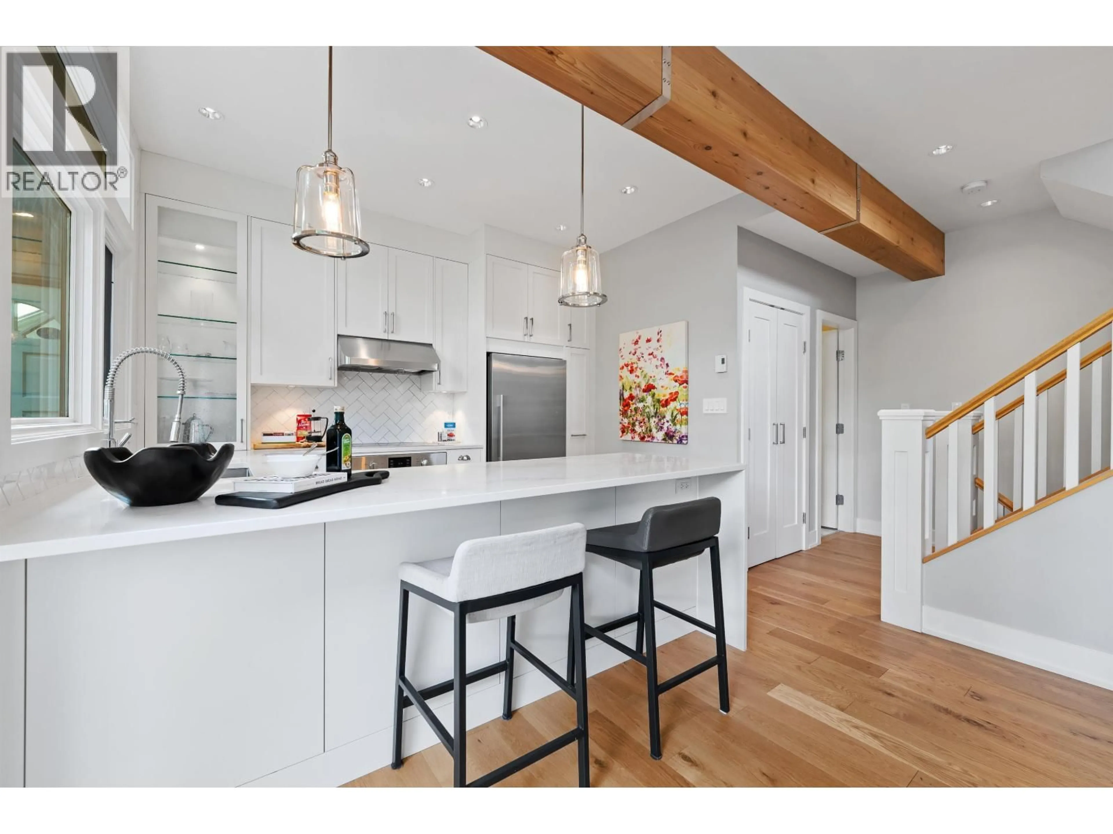 Open concept kitchen, wood/laminate floor for 1866 15TH AVENUE, Vancouver British Columbia V6J2L1