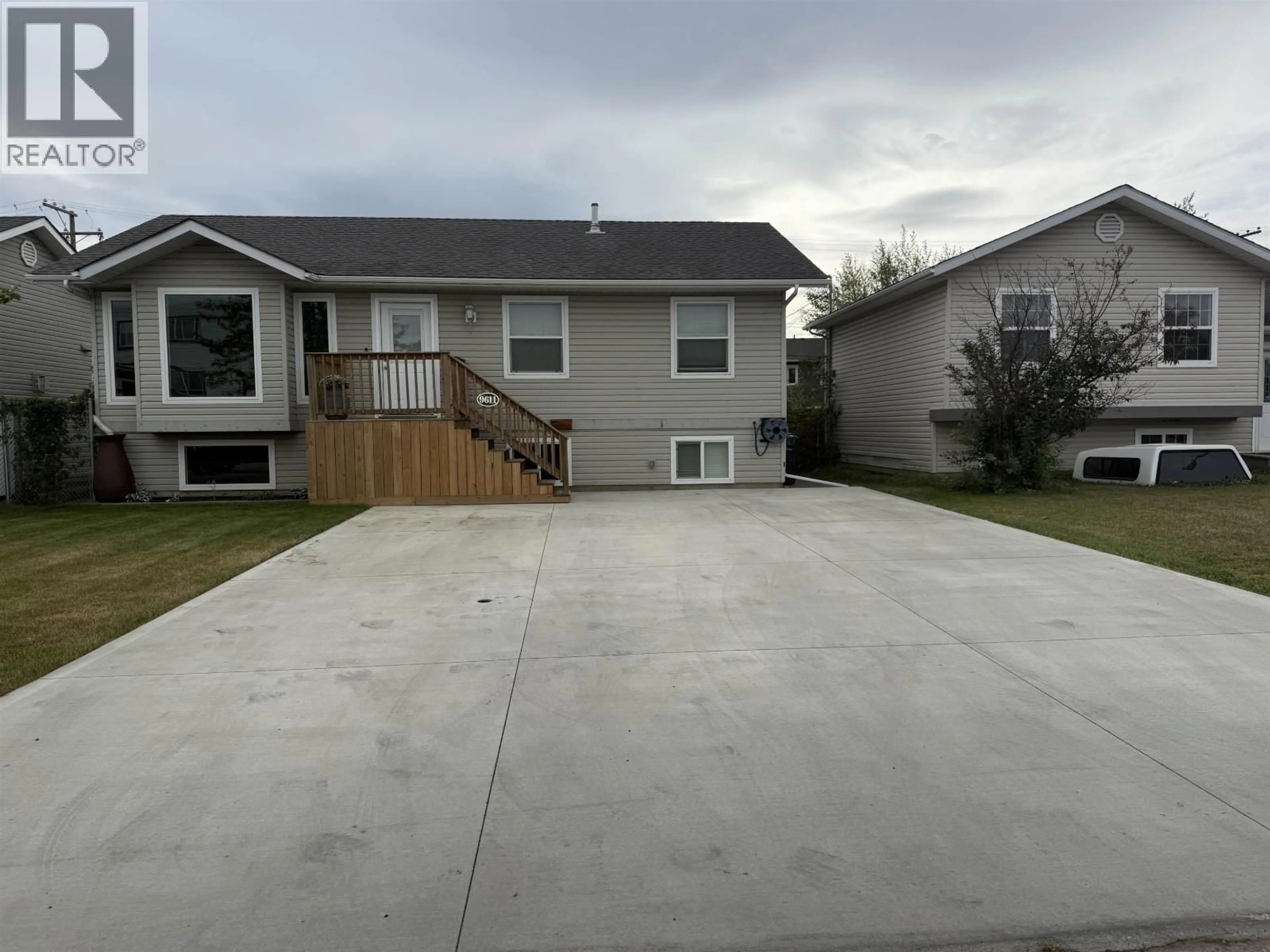 Home with vinyl exterior material, street for 9611 102 AVENUE, Fort St. John British Columbia V1J2C7