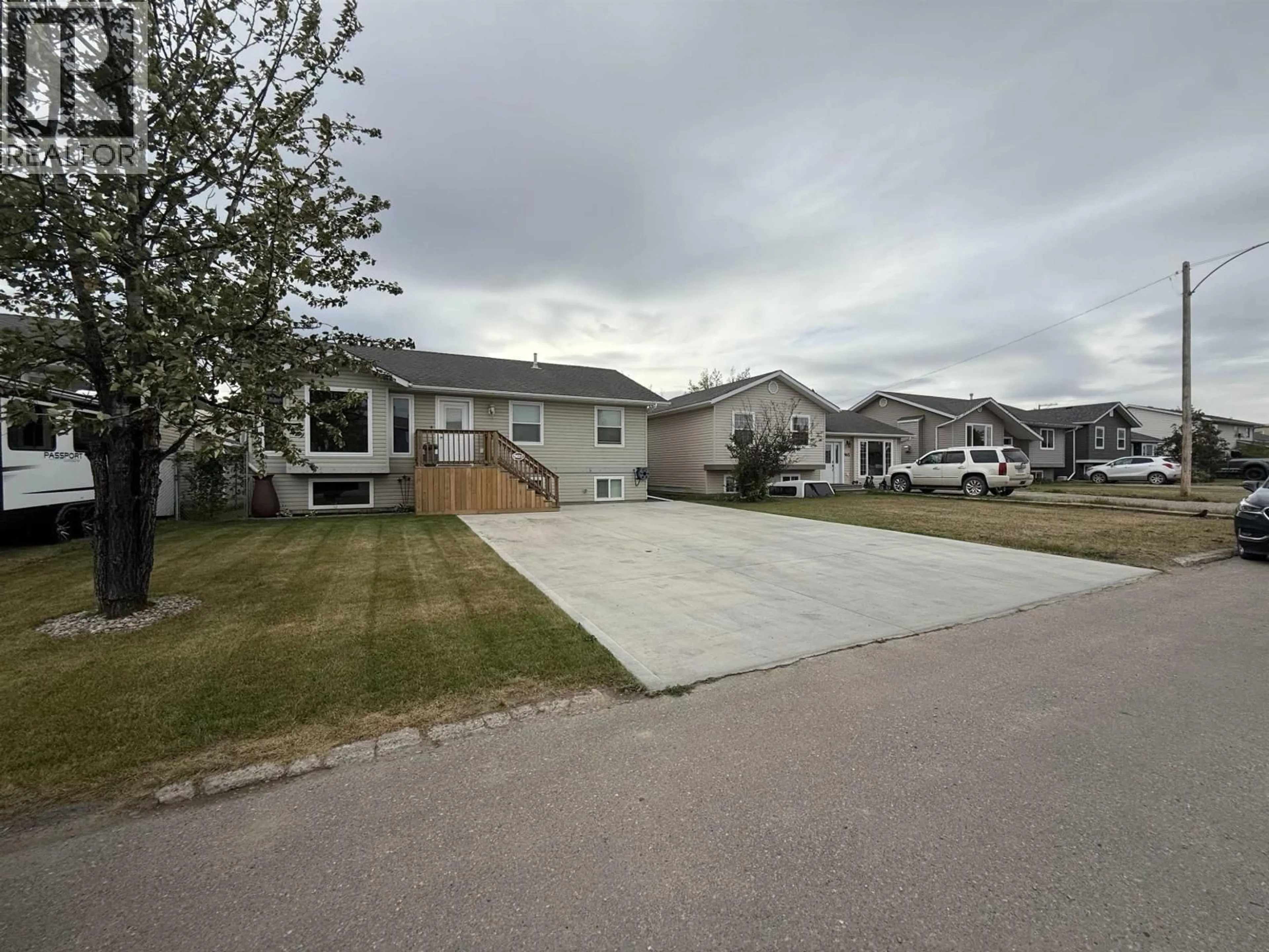 A pic from outside/outdoor area/front of a property/back of a property/a pic from drone, street for 9611 102 AVENUE, Fort St. John British Columbia V1J2C7