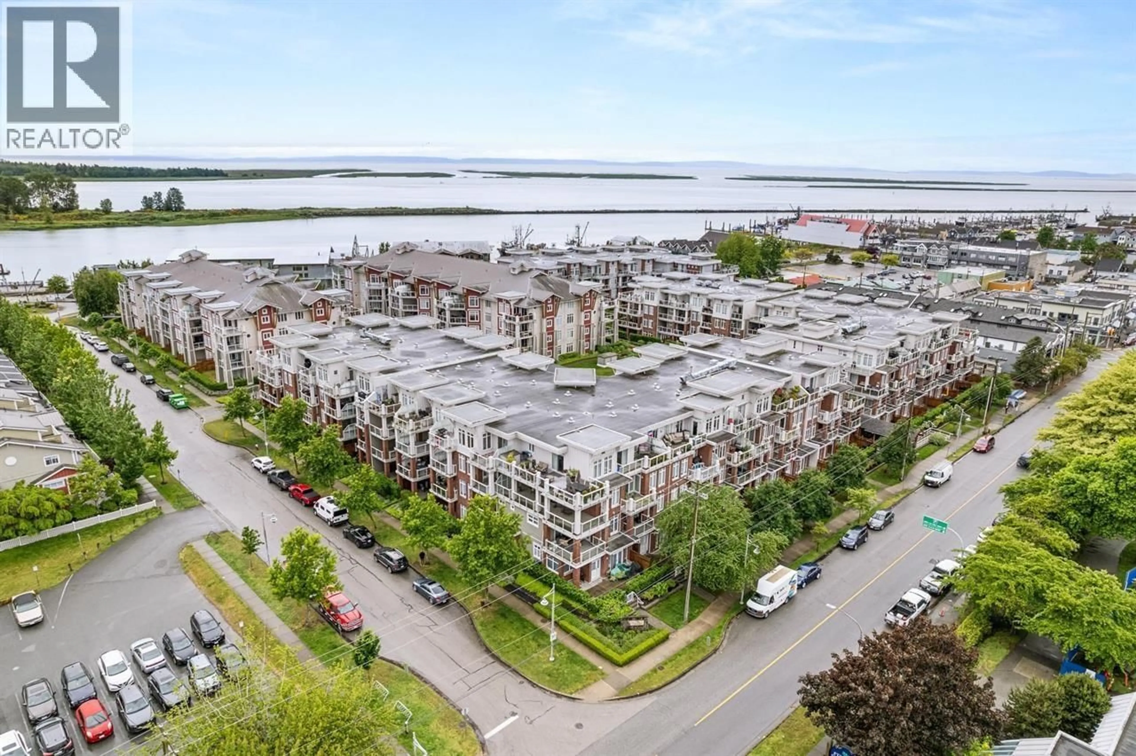 A pic from outside/outdoor area/front of a property/back of a property/a pic from drone, water/lake/river/ocean view for 210 - 4280 MONCTON STREET, Richmond British Columbia V7E6T4
