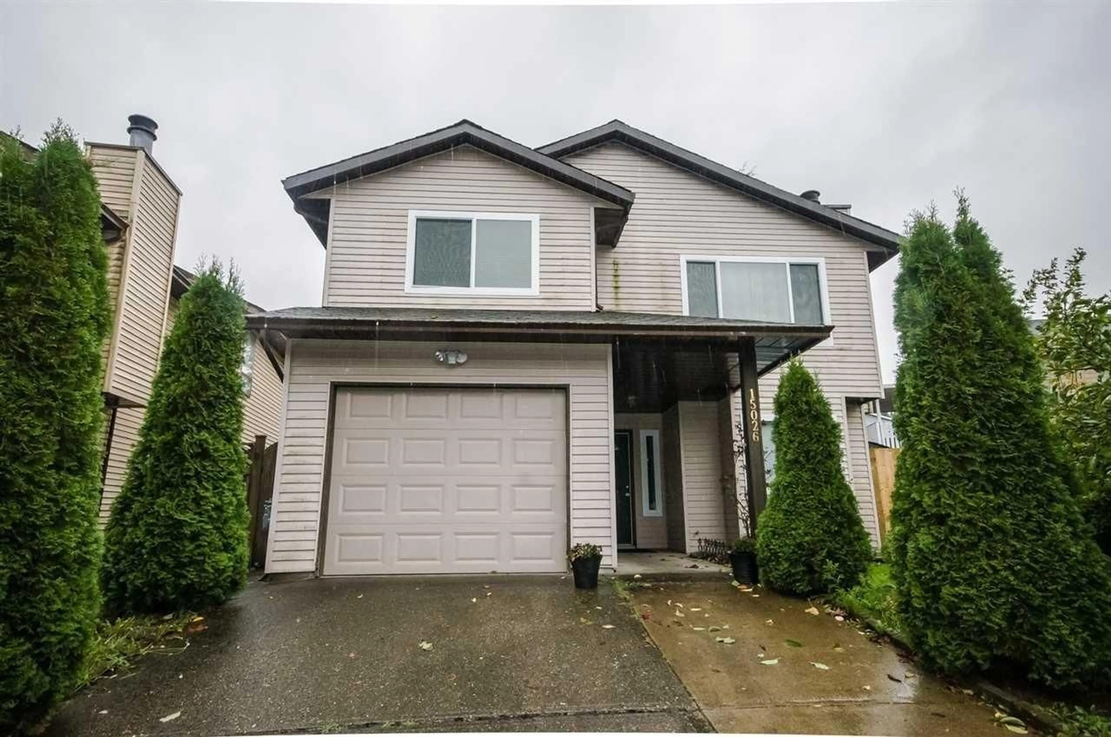 Home with vinyl exterior material, street for 15026 98A, Surrey British Columbia V3R8H3