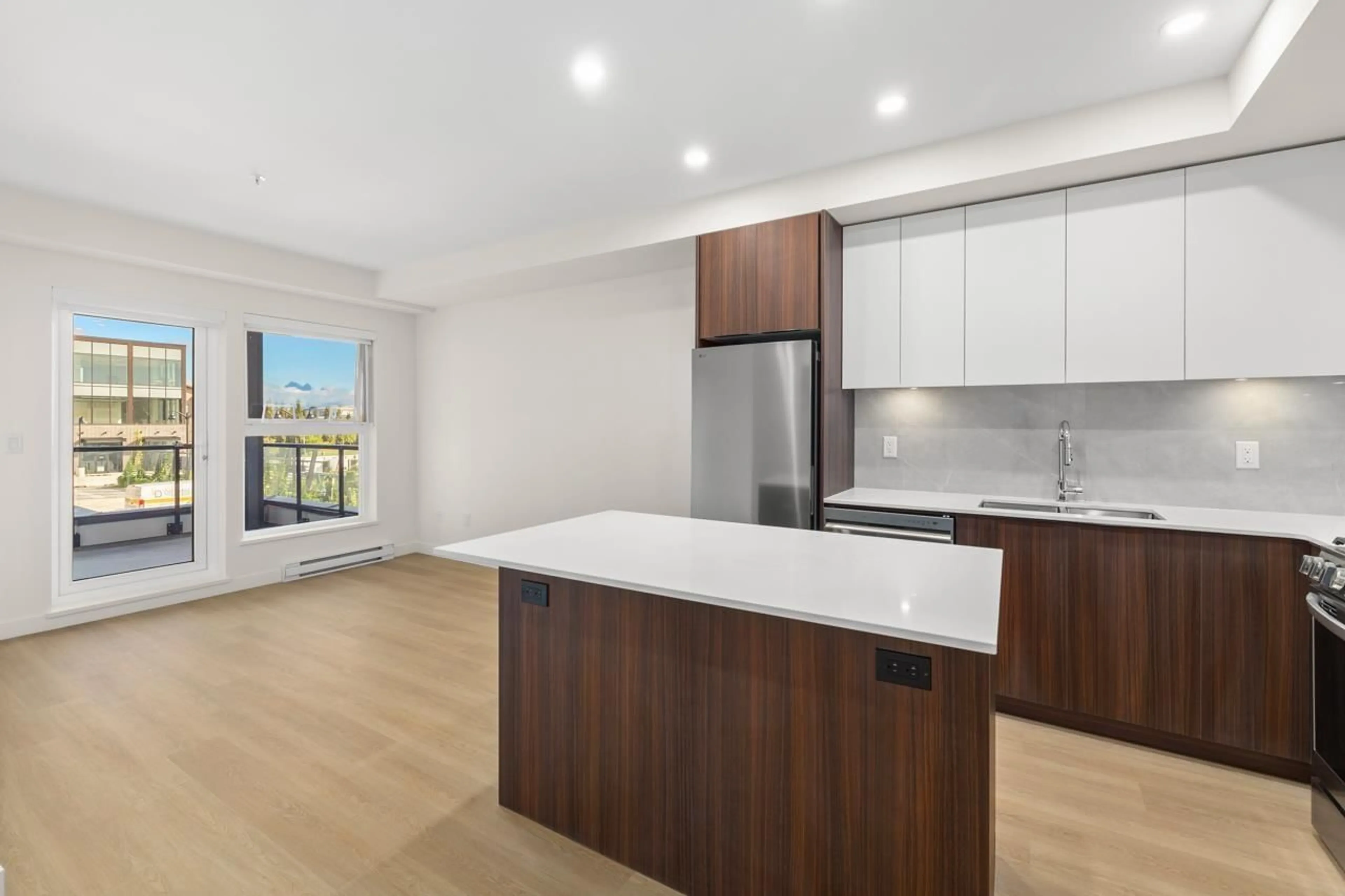 Open concept kitchen, wood/laminate floor for A314 - 7980 206A, Langley British Columbia V2Y1X6